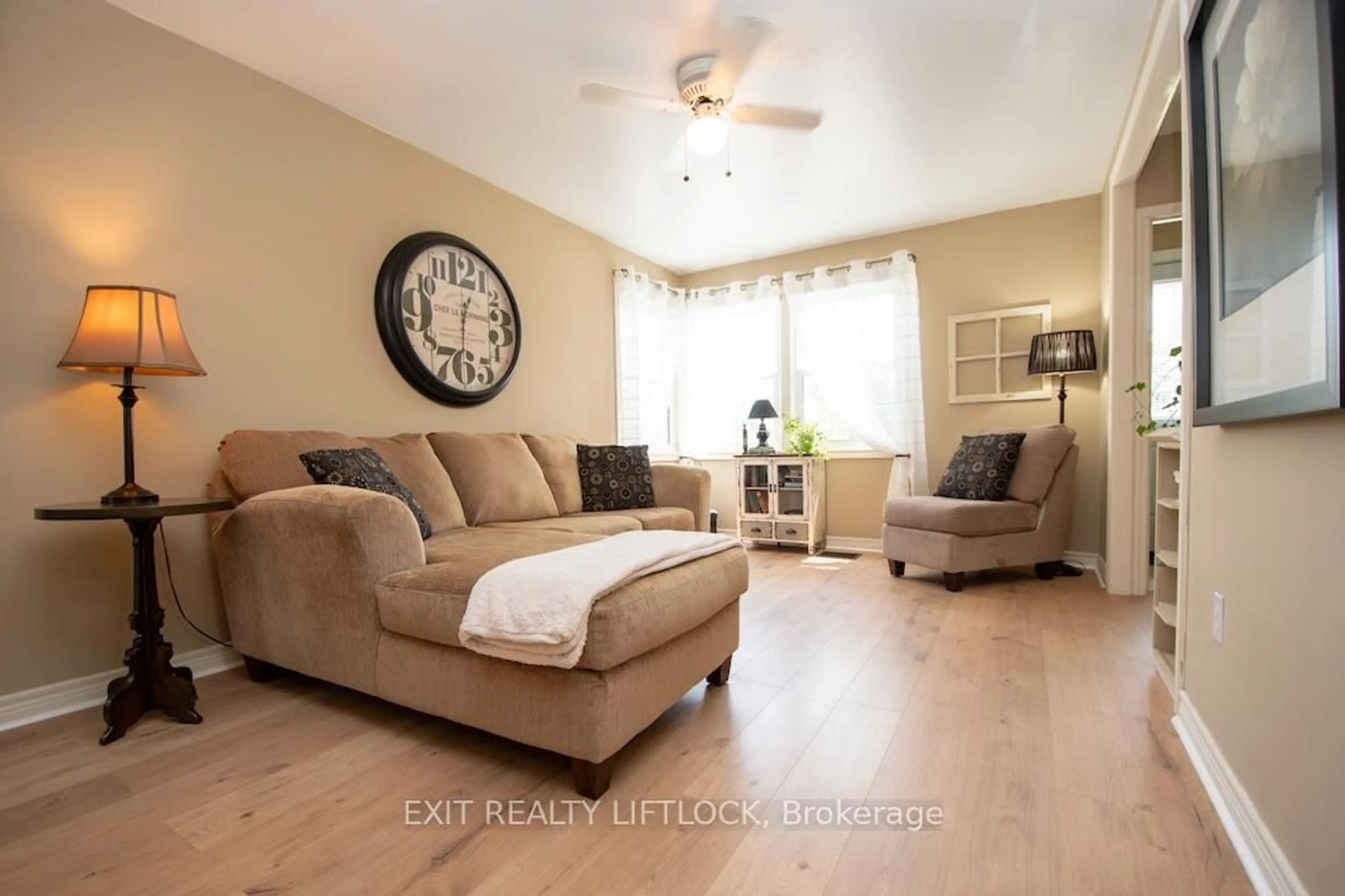 Living room with furniture, wood/laminate floor for 26 Victoria Ave, Peterborough North Ontario K9H 4V7