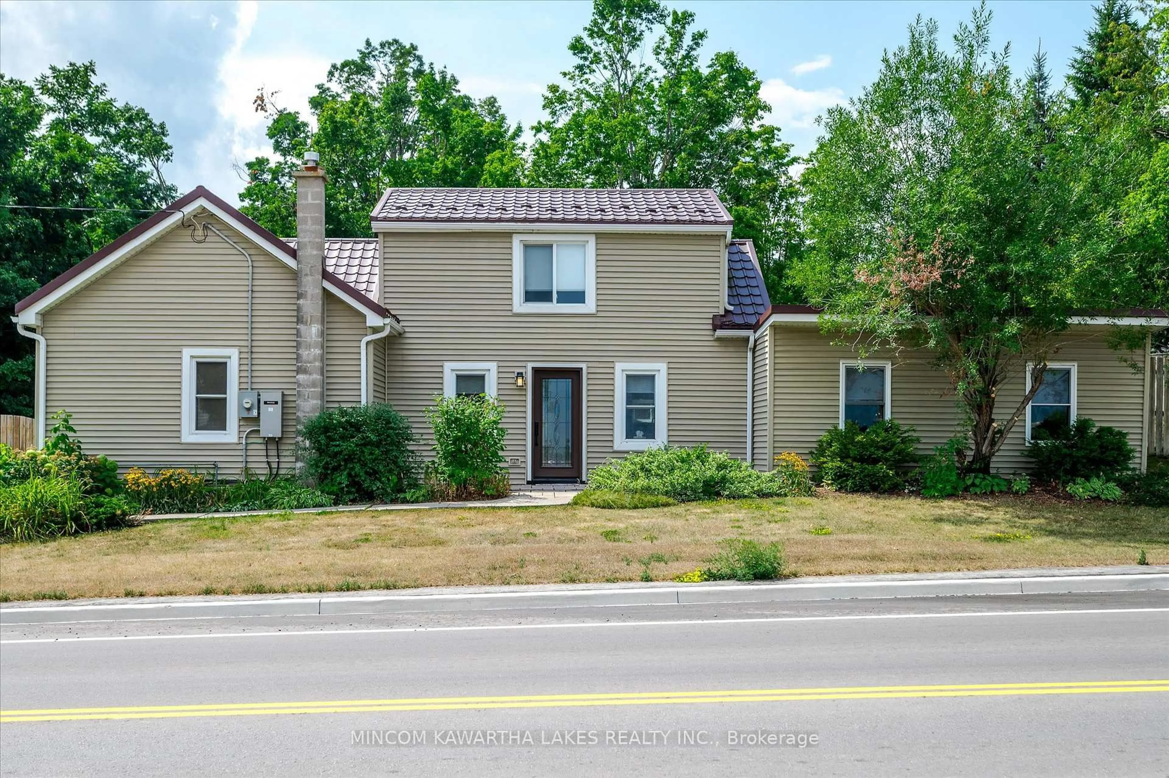 Home with vinyl exterior material, street for 2466 Queen Mary St, Cavan Monaghan Ontario L0A 1C0