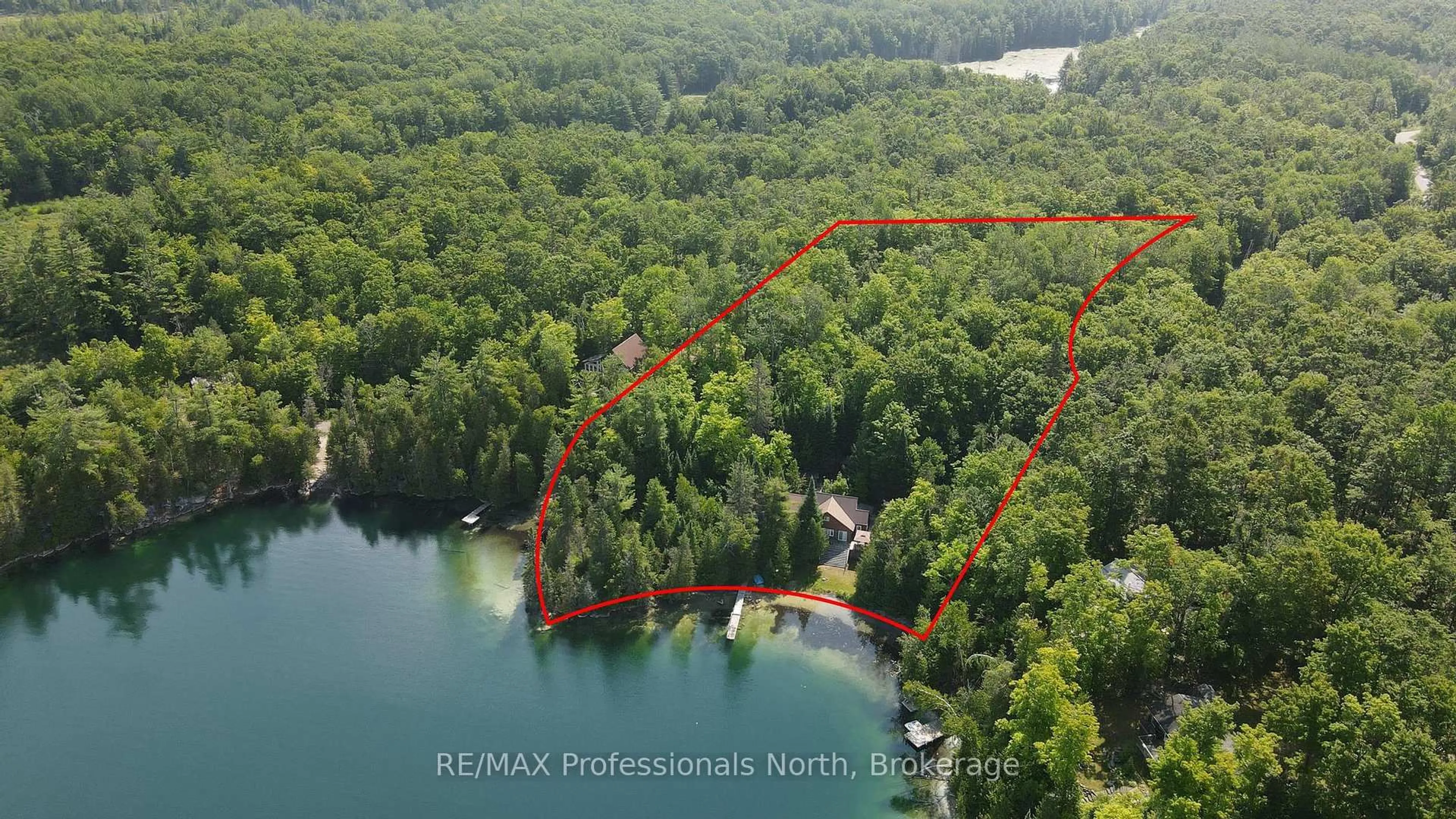 A pic from outside/outdoor area/front of a property/back of a property/a pic from drone, water/lake/river/ocean view for 1026 Woodpecker Tr, Minden Hills Ontario K0M 2K0