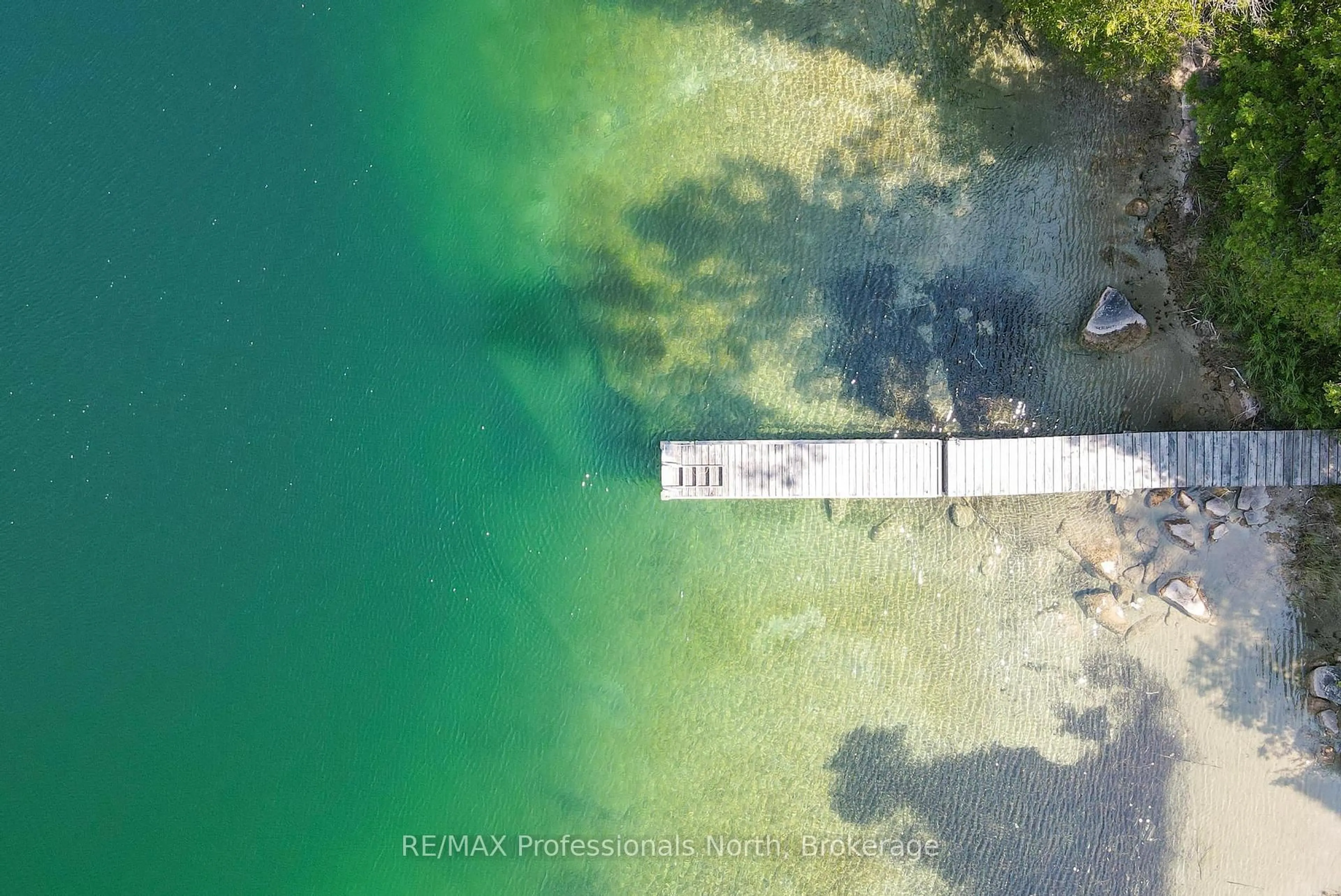 A pic from outside/outdoor area/front of a property/back of a property/a pic from drone, water/lake/river/ocean view for 1026 Woodpecker Tr, Minden Hills Ontario K0M 2K0