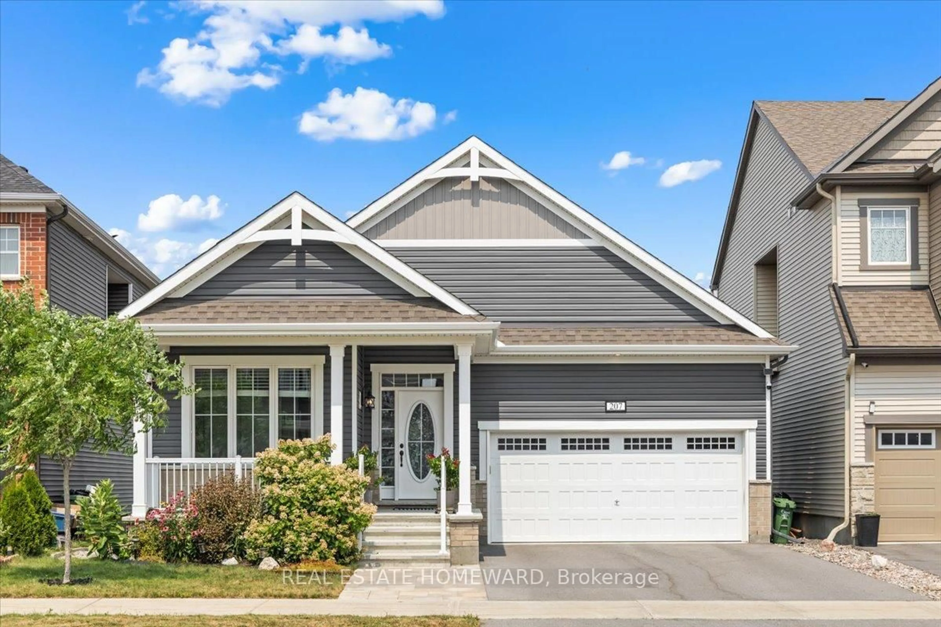 Home with vinyl exterior material, street for 207 Cranesbill Rd, Ottawa Ontario K2V 0N5