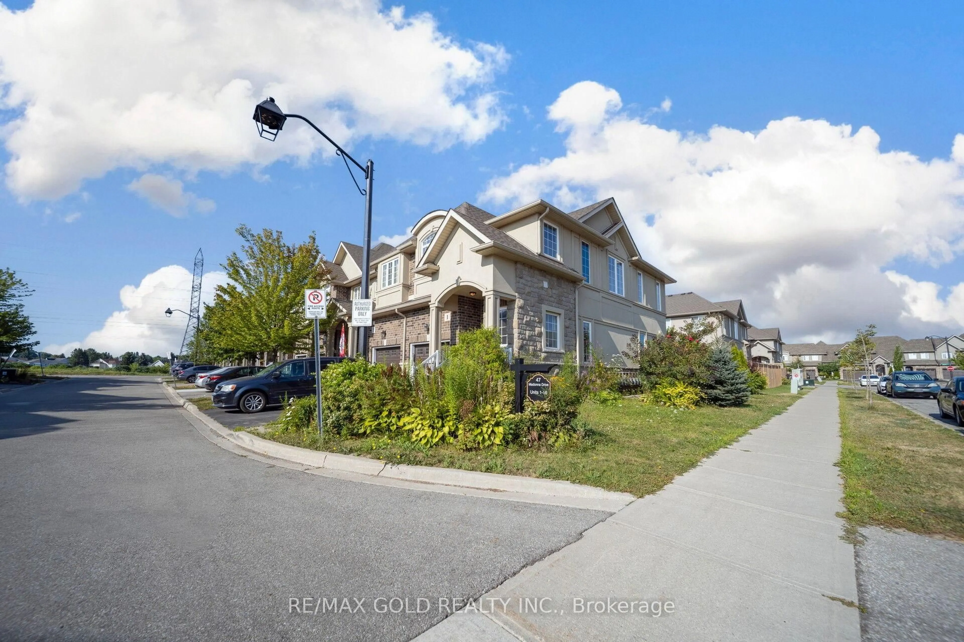 A pic from outside/outdoor area/front of a property/back of a property/a pic from drone, street for 47 Madonna Dr #1, Hamilton Ontario L9B 0H2