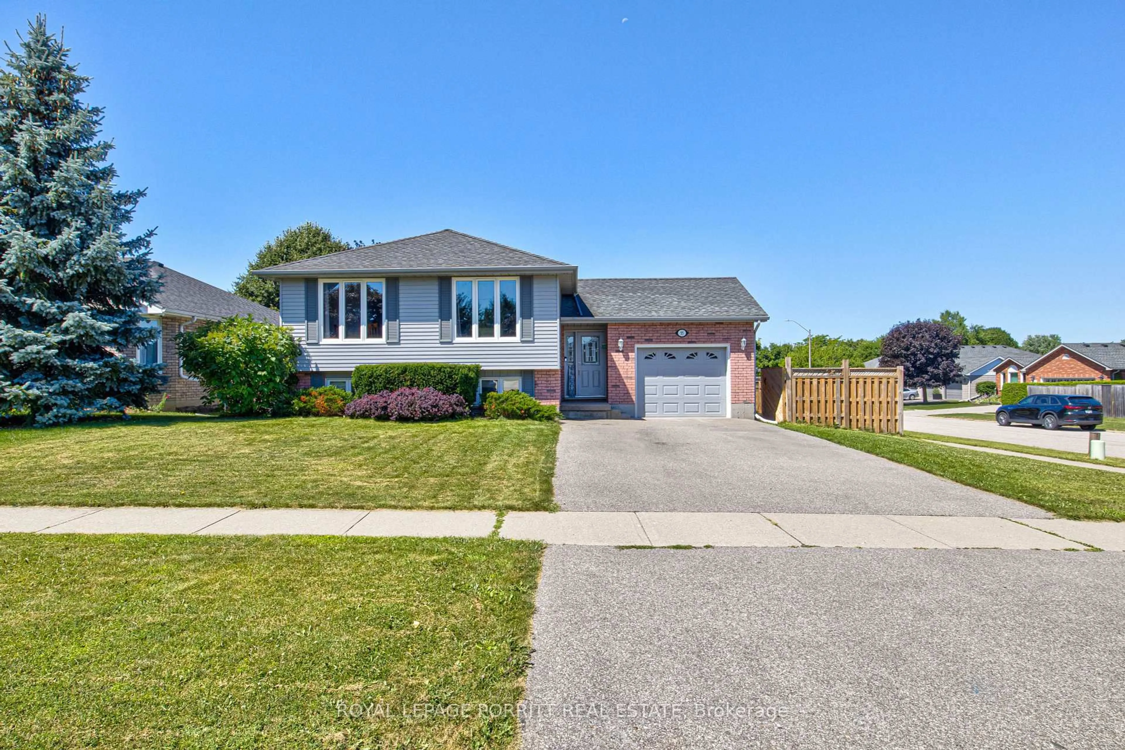 Home with vinyl exterior material, street for 55 Windsor Dr, Brant Ontario N0E 1N0