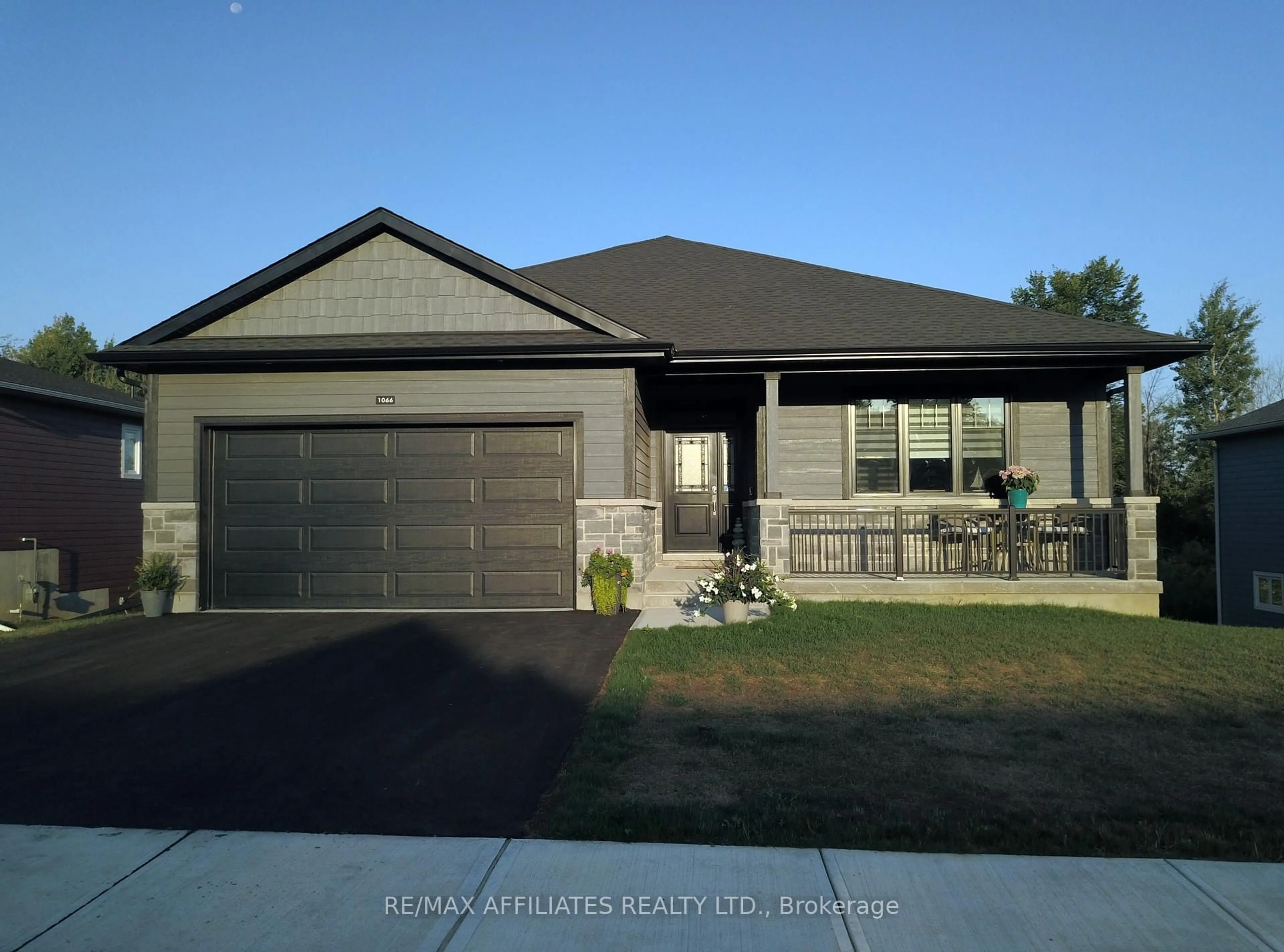 Home with vinyl exterior material, street for 1066 Shearer Dr, Brockville Ontario K6V 7K1