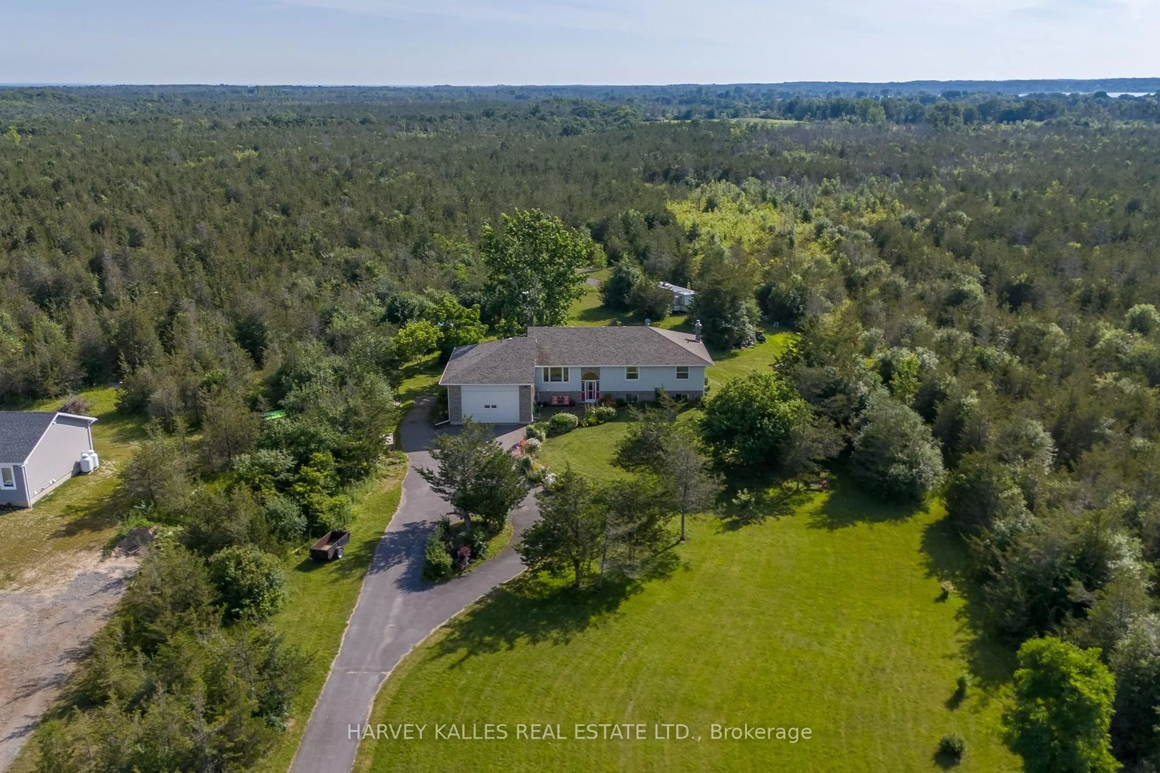 A pic from outside/outdoor area/front of a property/back of a property/a pic from drone, water/lake/river/ocean view for 3470 County Rd 13 Rd, Prince Edward County Ontario K0K 2T0
