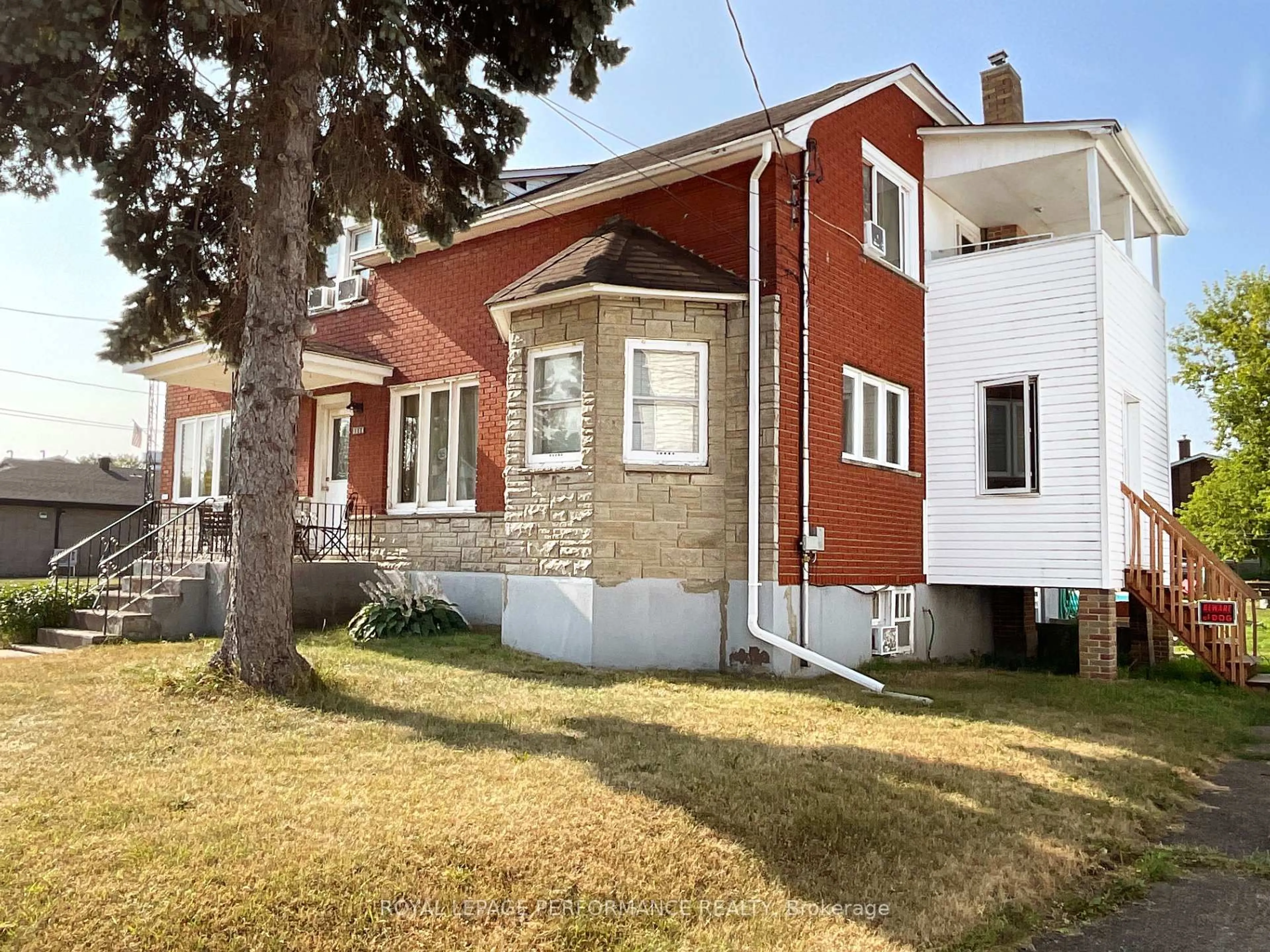 Home with brick exterior material, street for 1312-1314 Main St, Hawkesbury Ontario K6A 1C4