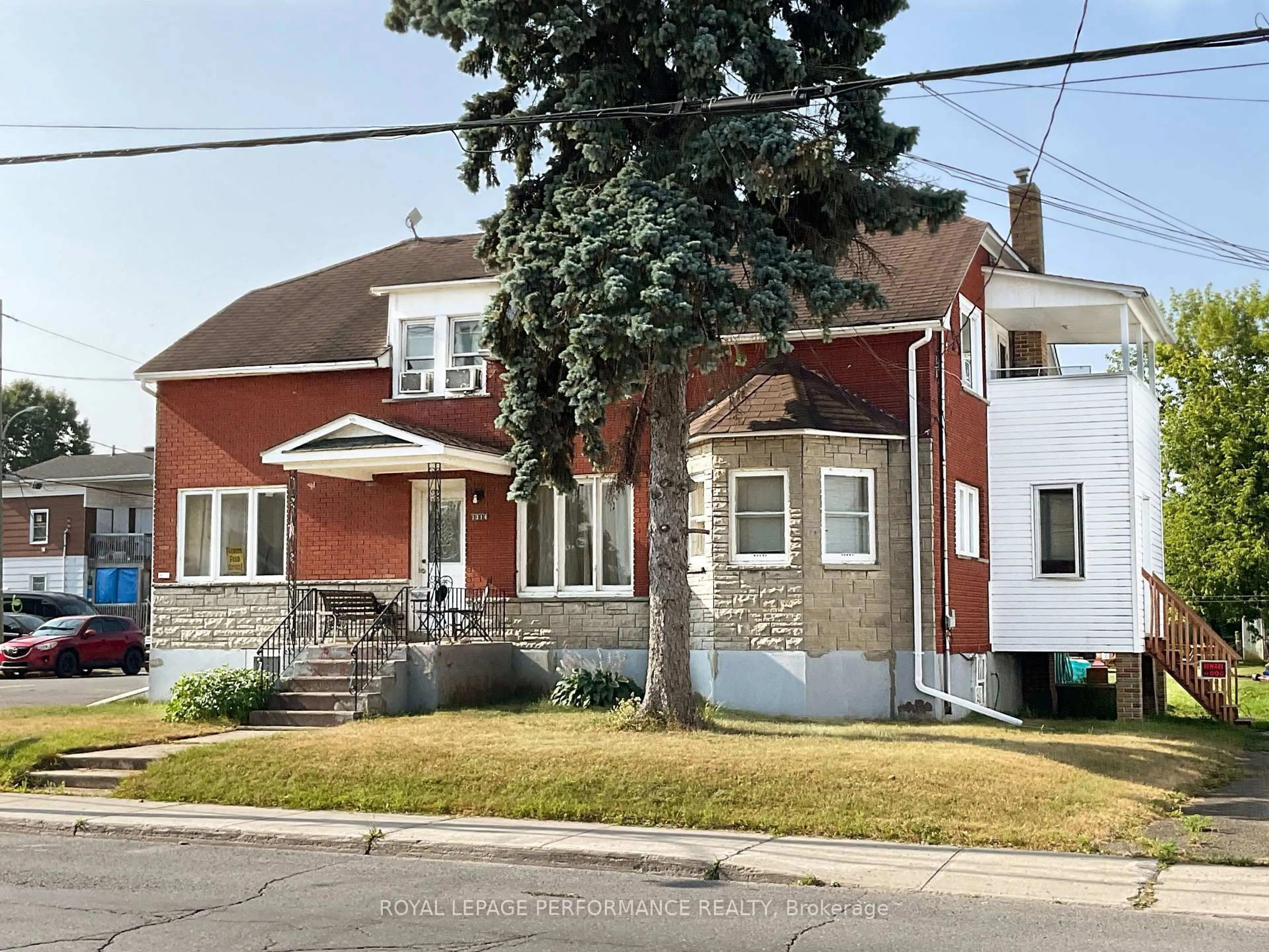 Home with brick exterior material, street for 1312-1314 Main St, Hawkesbury Ontario K6A 1C4