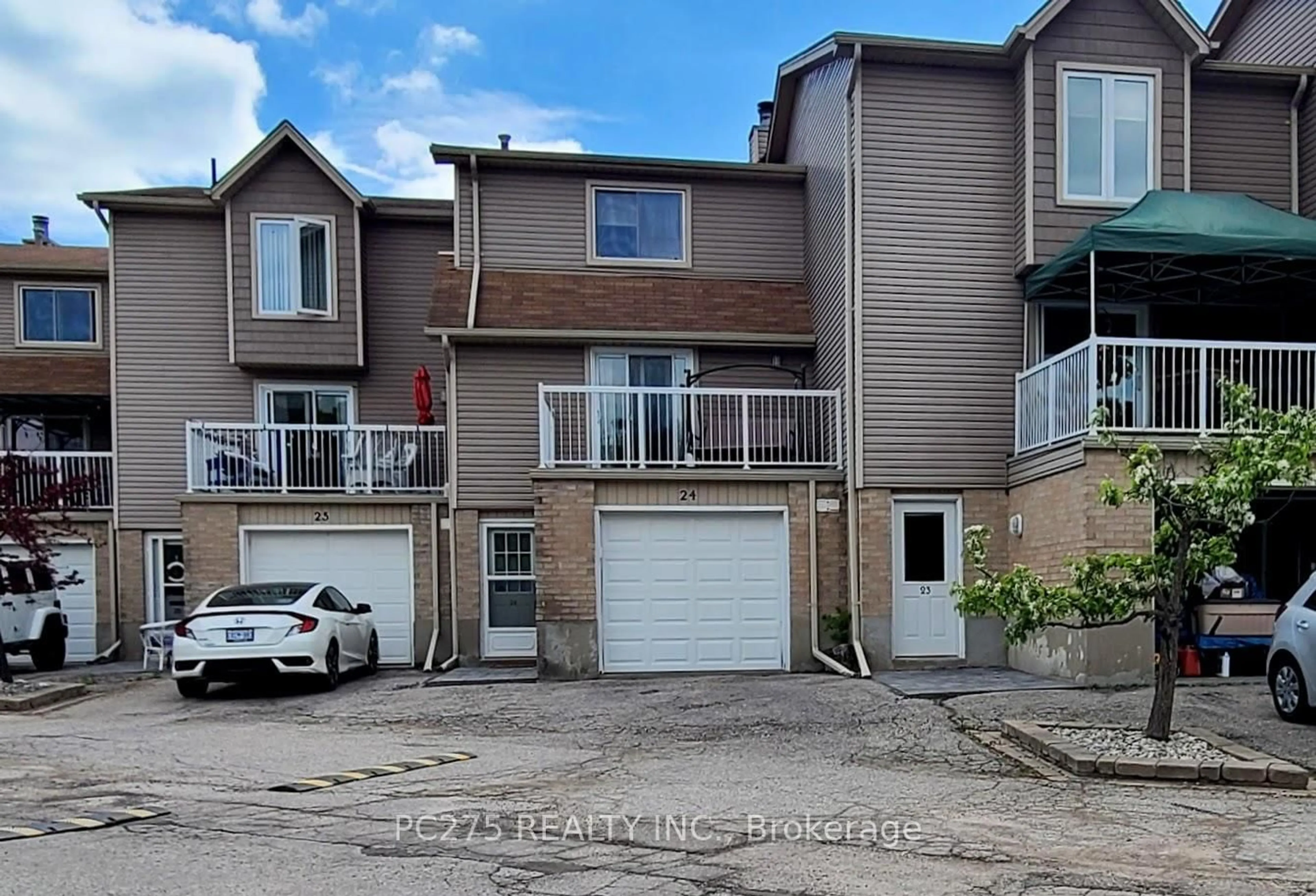 A pic from outside/outdoor area/front of a property/back of a property/a pic from drone, street for 301 Carlow Rd #24, Central Elgin Ontario N5L 1B7