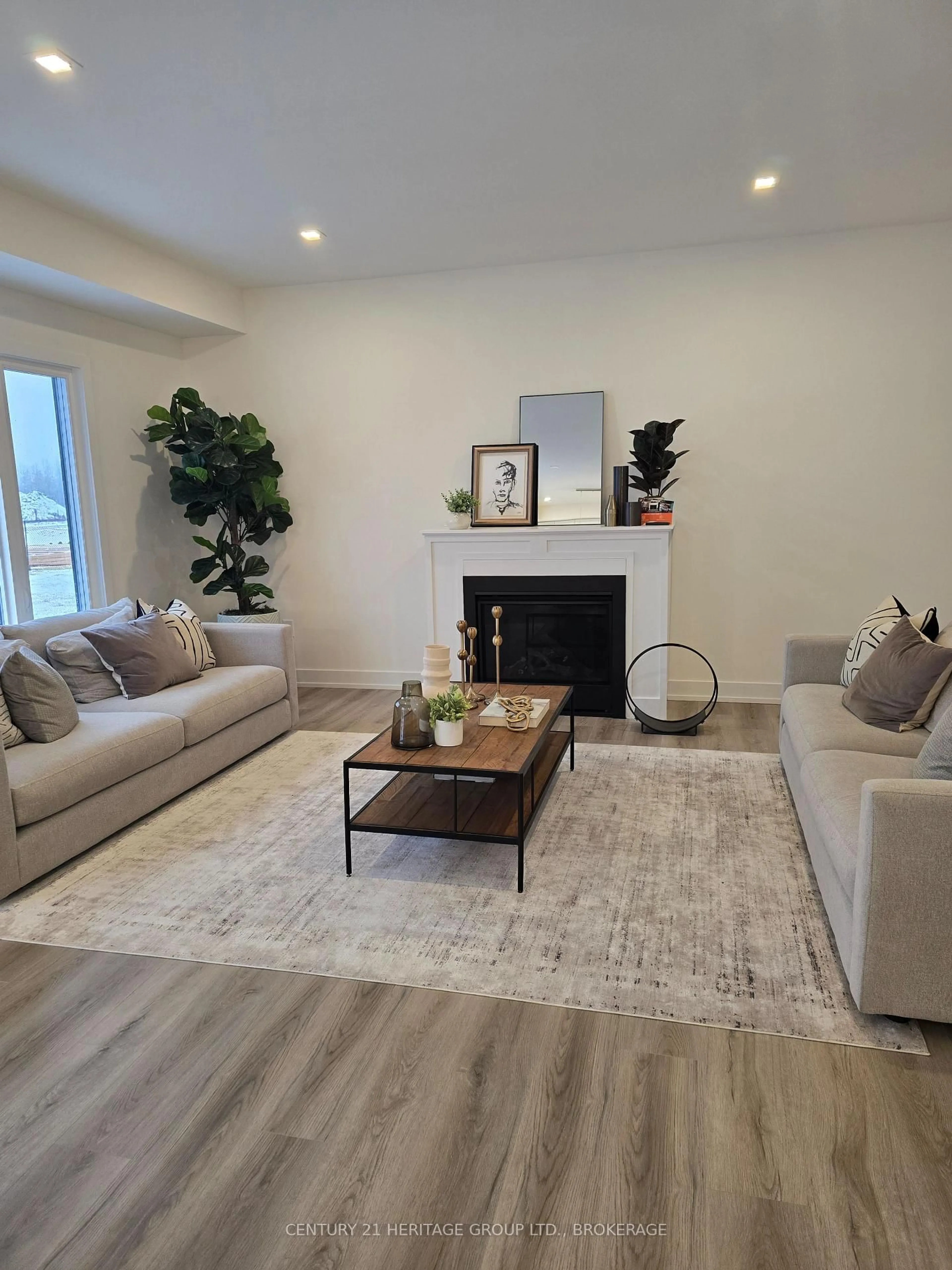 Living room with furniture, wood/laminate floor for 98 Creighton Dr #Lot 52, Bissett Creek Ontario K0H 2H0