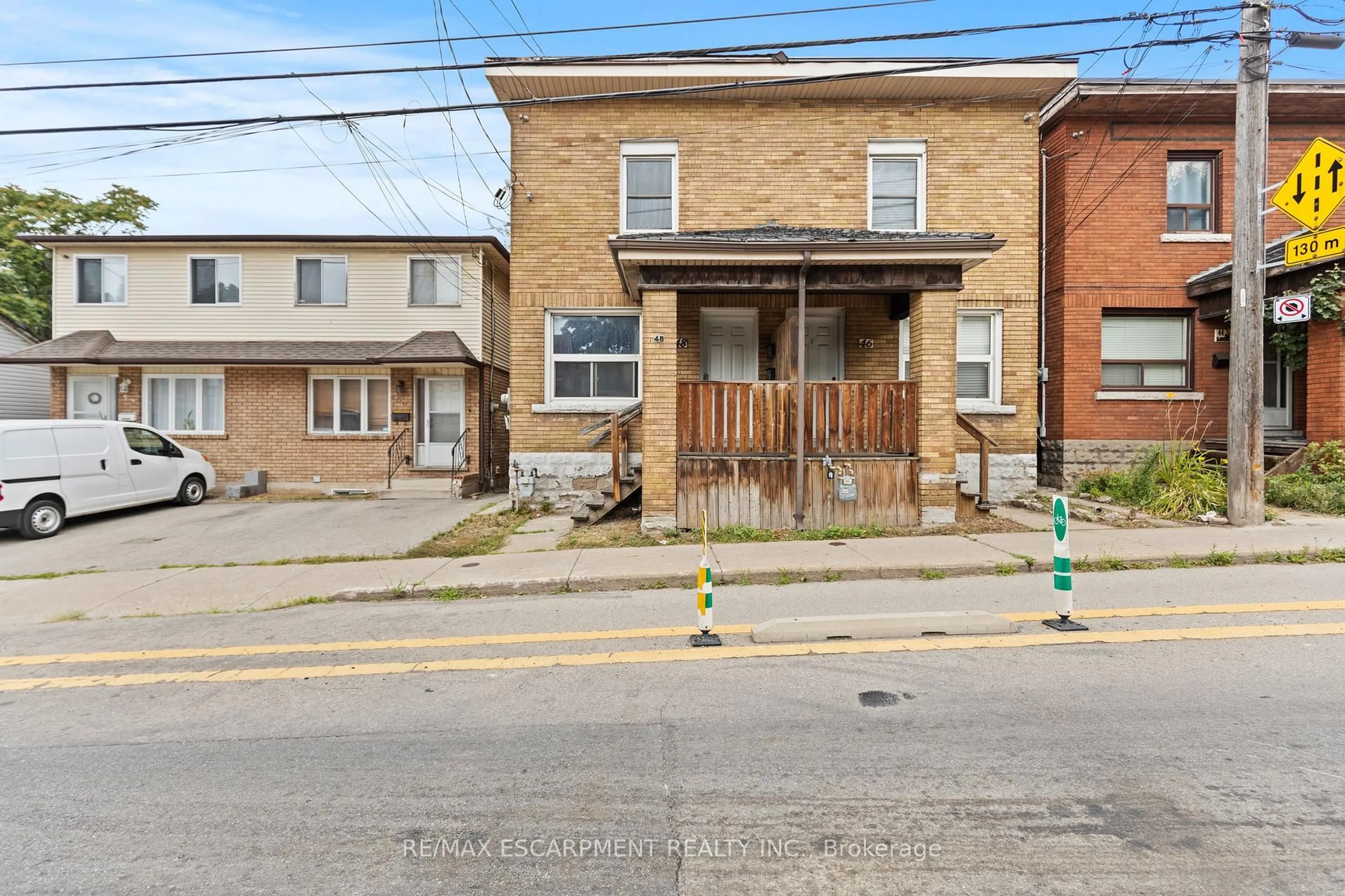 Home with brick exterior material, street for 48 Locke St, Hamilton Ontario L8P 3Z8