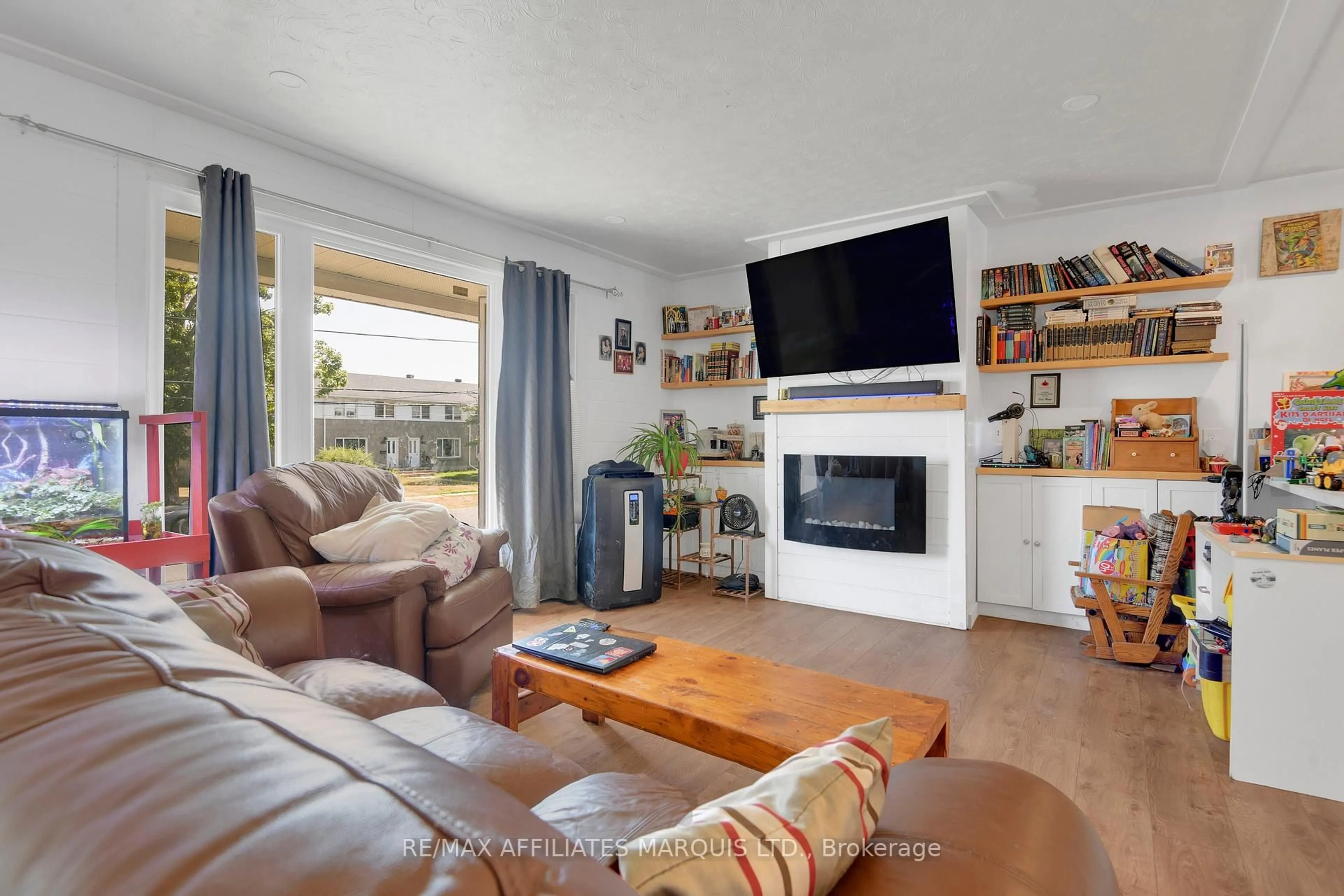Living room with furniture, wood/laminate floor for 1340 Alfred St, Cornwall Ontario K6J 4Z8