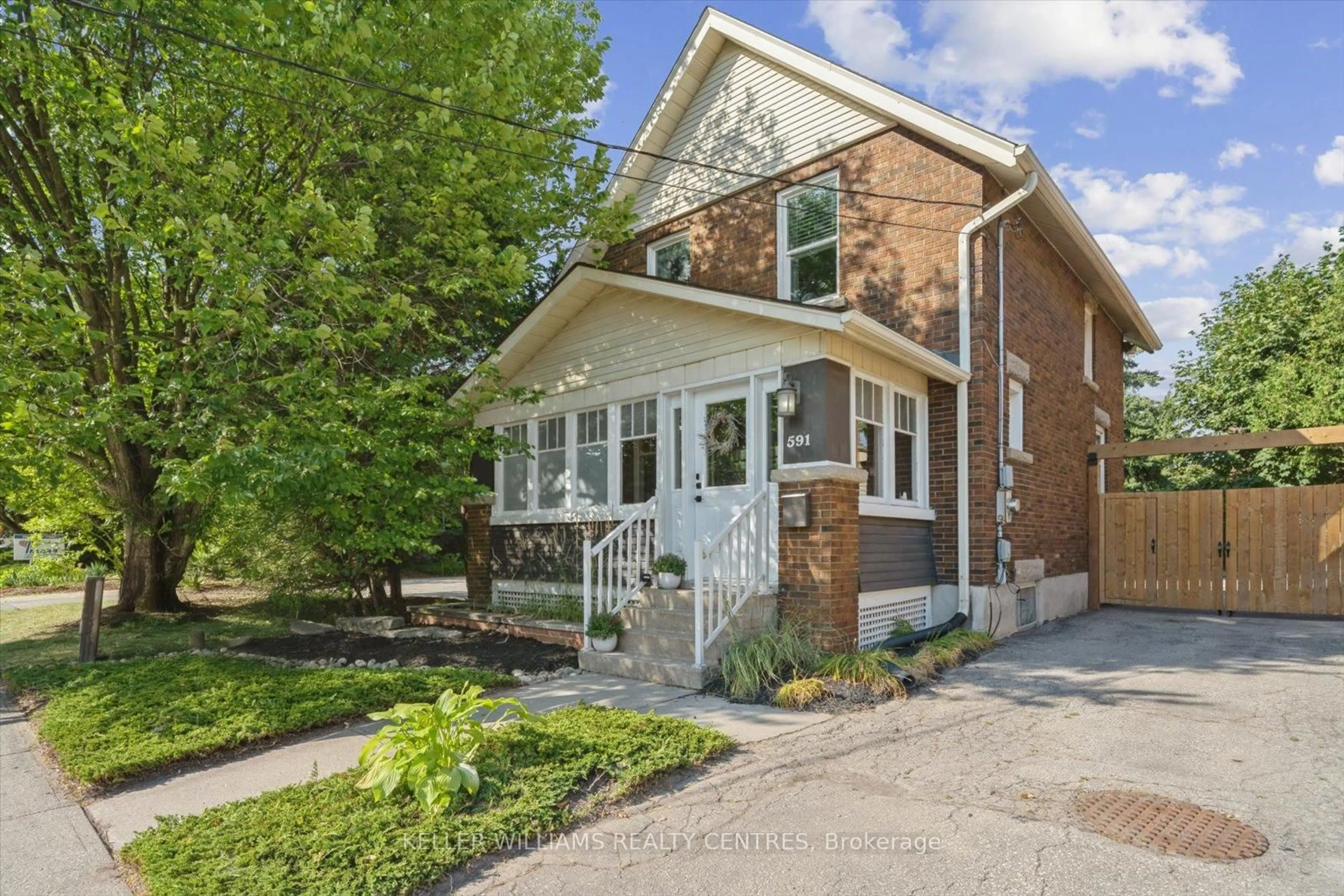 Home with brick exterior material, street for 591 Woolwich St, Guelph Ontario N1H 3Y5