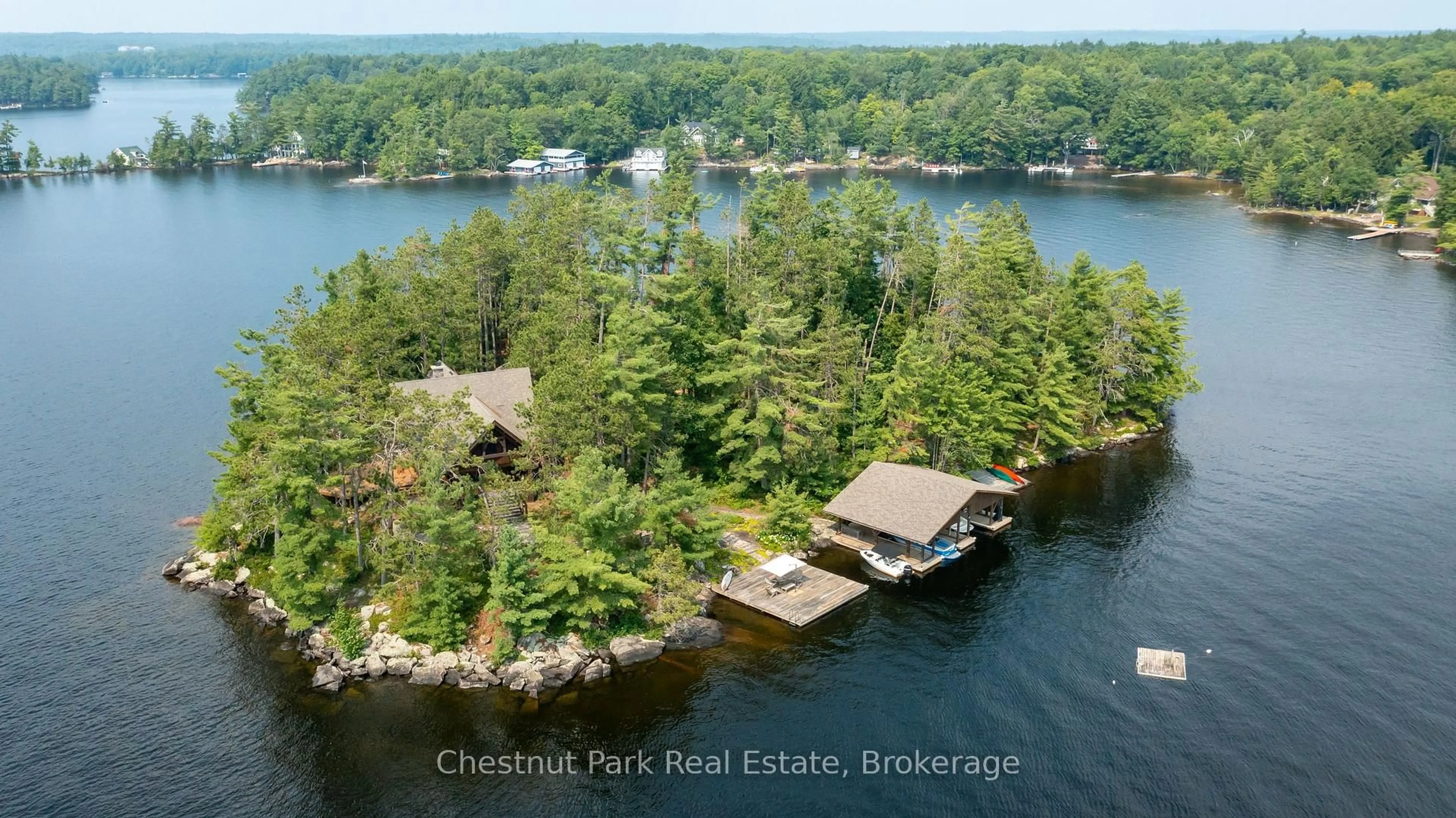 A pic from outside/outdoor area/front of a property/back of a property/a pic from drone, water/lake/river/ocean view for 1000 Little Baxter (AKA Rockwood) Island, Bracebridge Ontario P1L 1W8