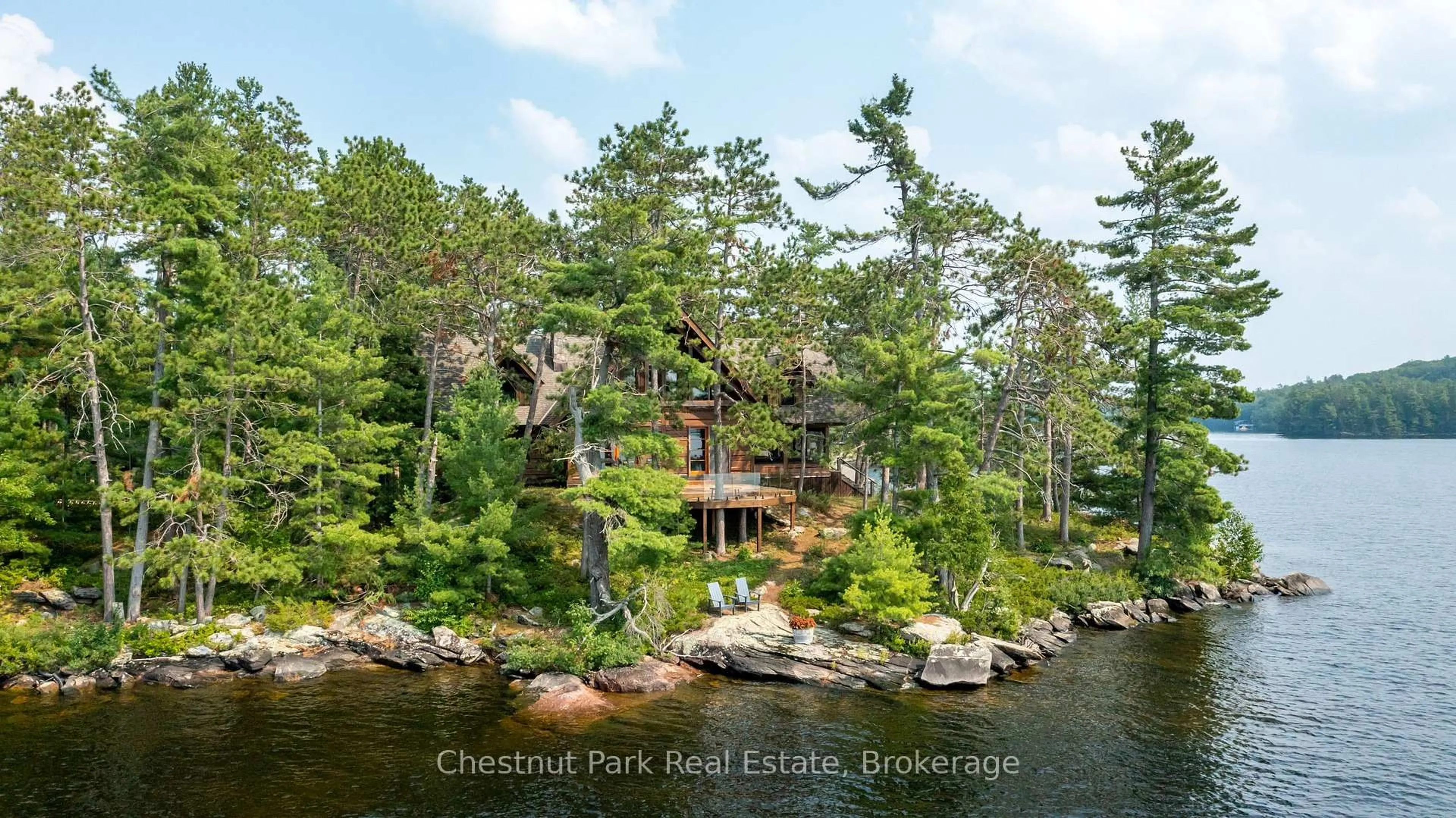 A pic from outside/outdoor area/front of a property/back of a property/a pic from drone, water/lake/river/ocean view for 1000 Little Baxter (AKA Rockwood) Island, Bracebridge Ontario P1L 1W8