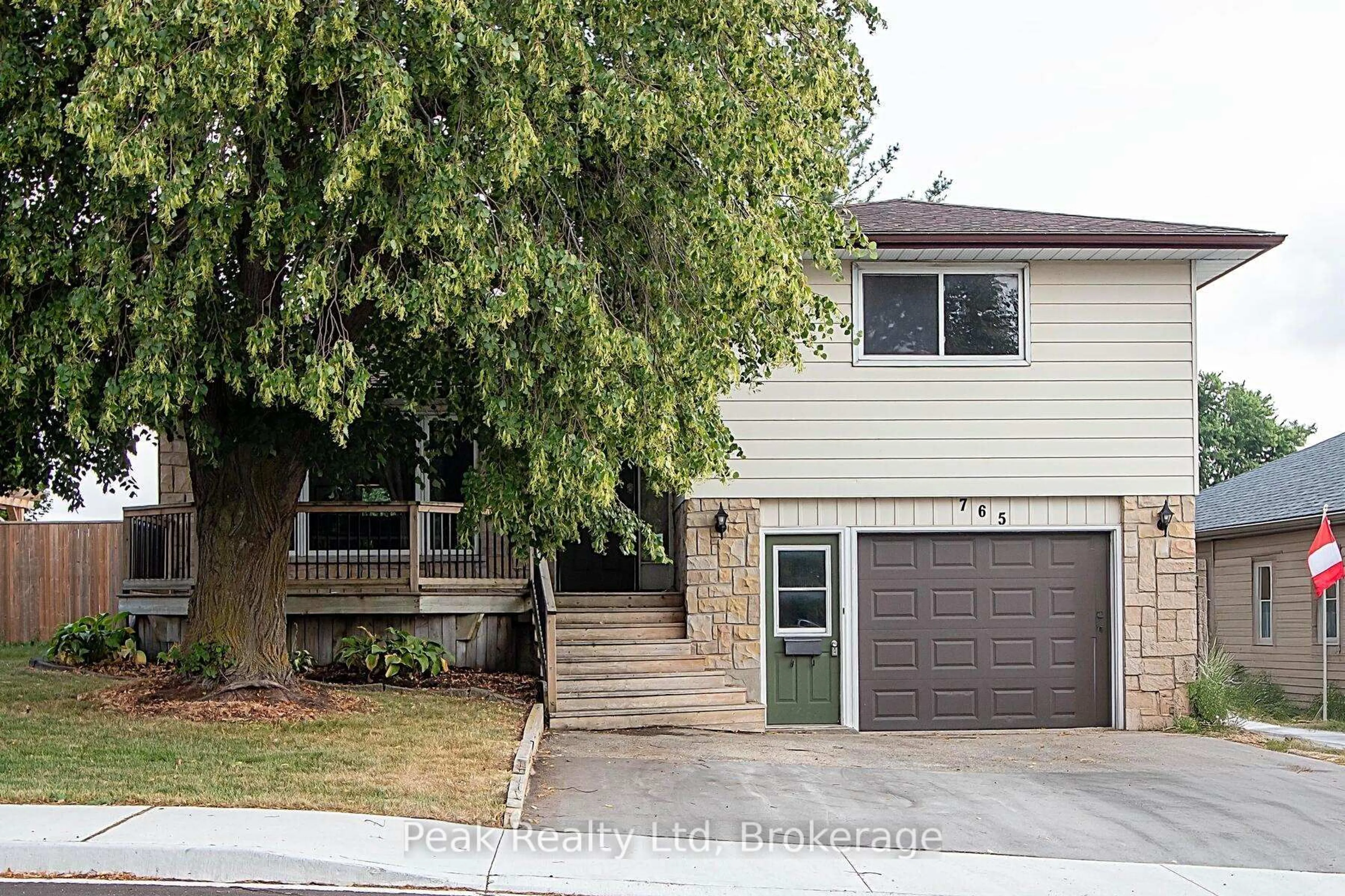 Home with vinyl exterior material, street for 765 John St, North Perth Ontario N4W 1B6