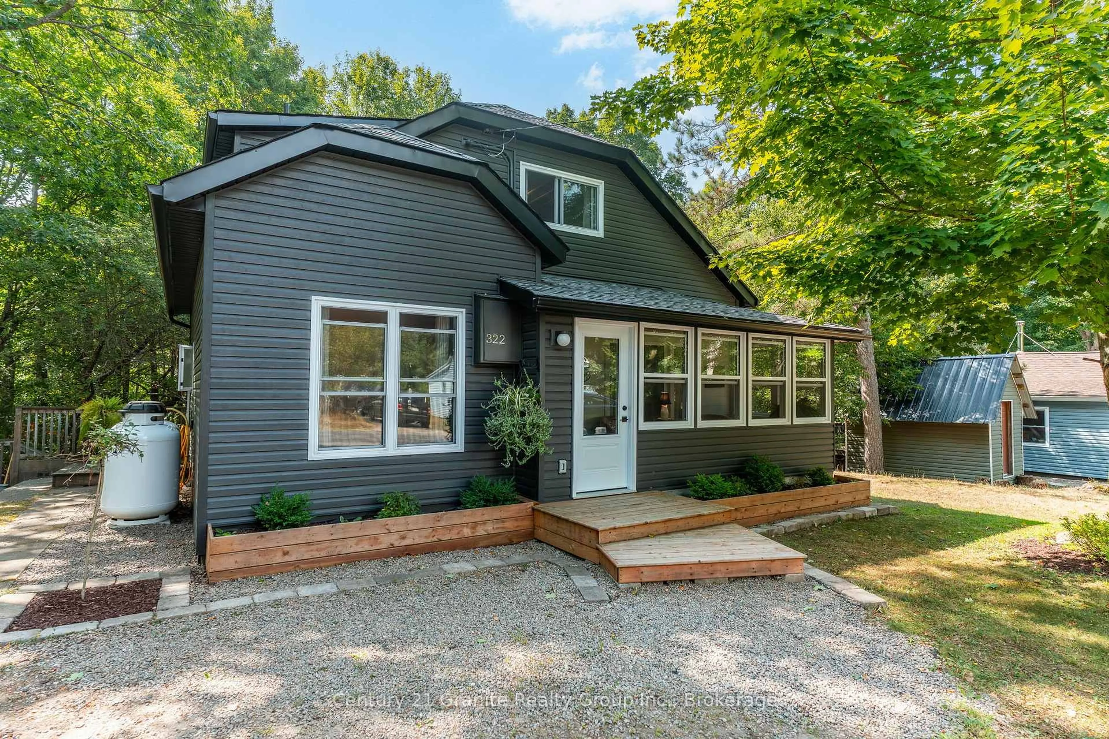 Home with vinyl exterior material, street for 322 Highland St, Dysart et al Ontario K0M 1S0
