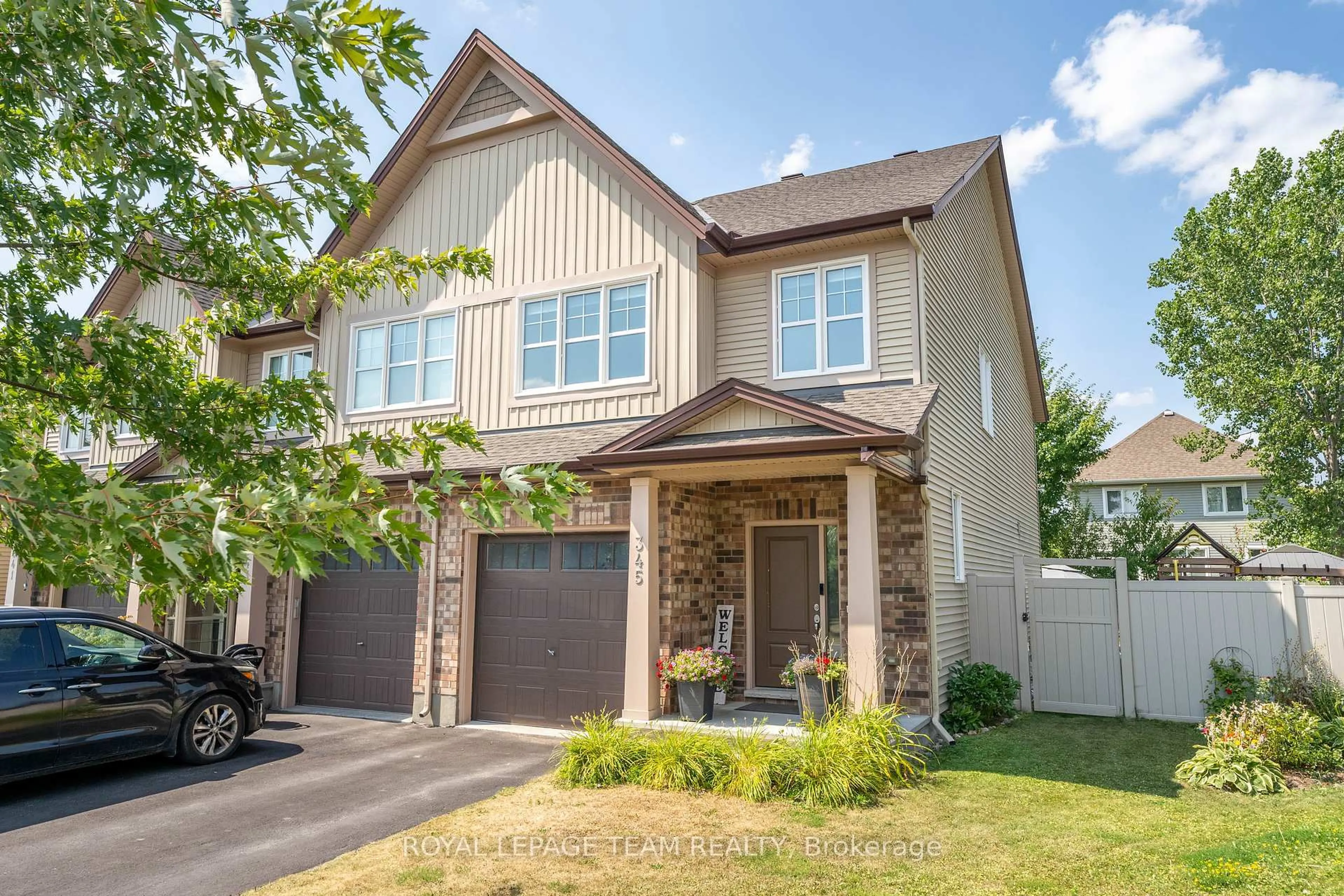 Home with brick exterior material, street for 345 Alasken Dr, Ottawa Ontario K1T 0M4
