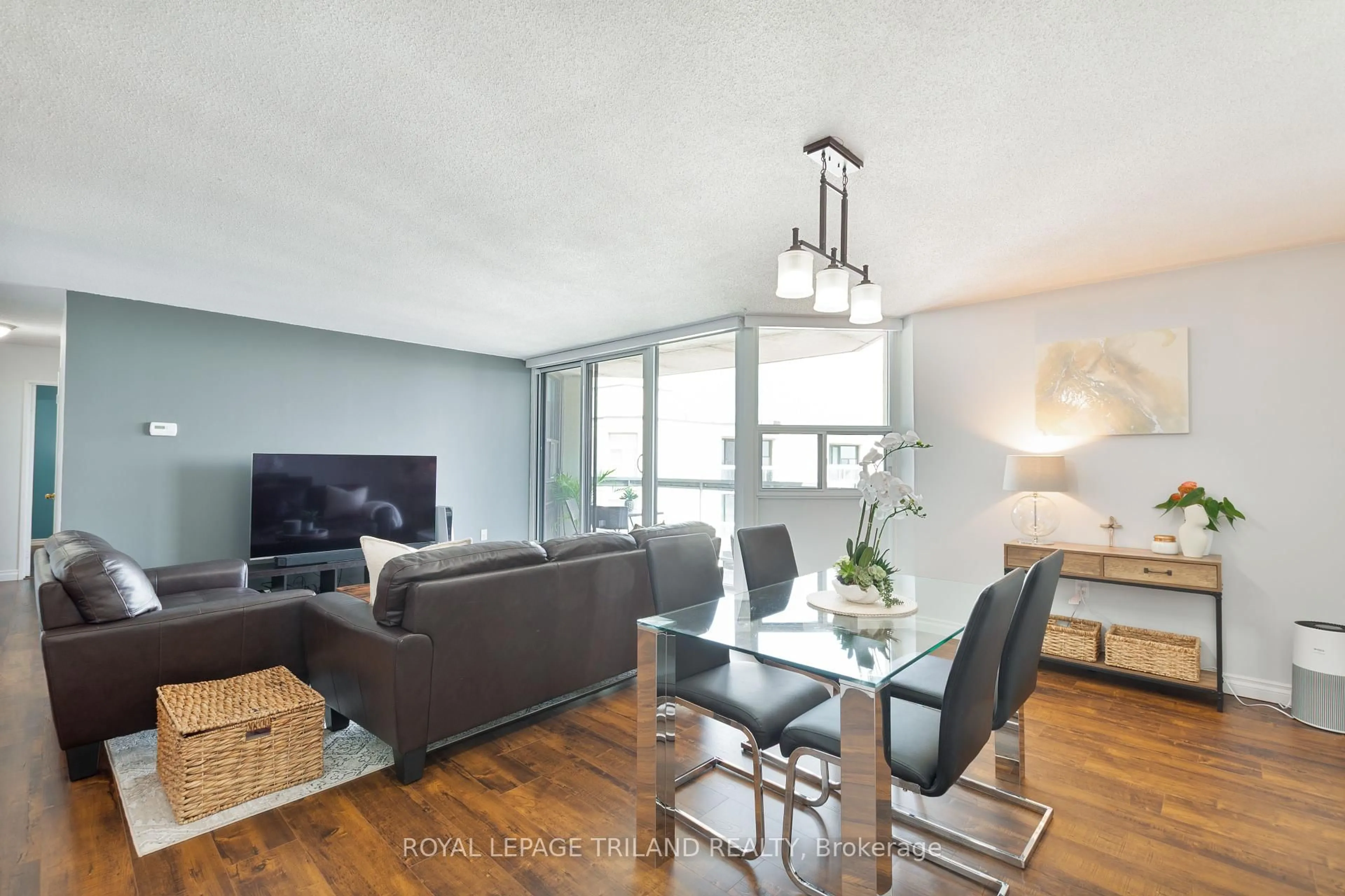 Living room with furniture, wood/laminate floor for 323 Colborne St #2703, London East Ontario N6B 3N8
