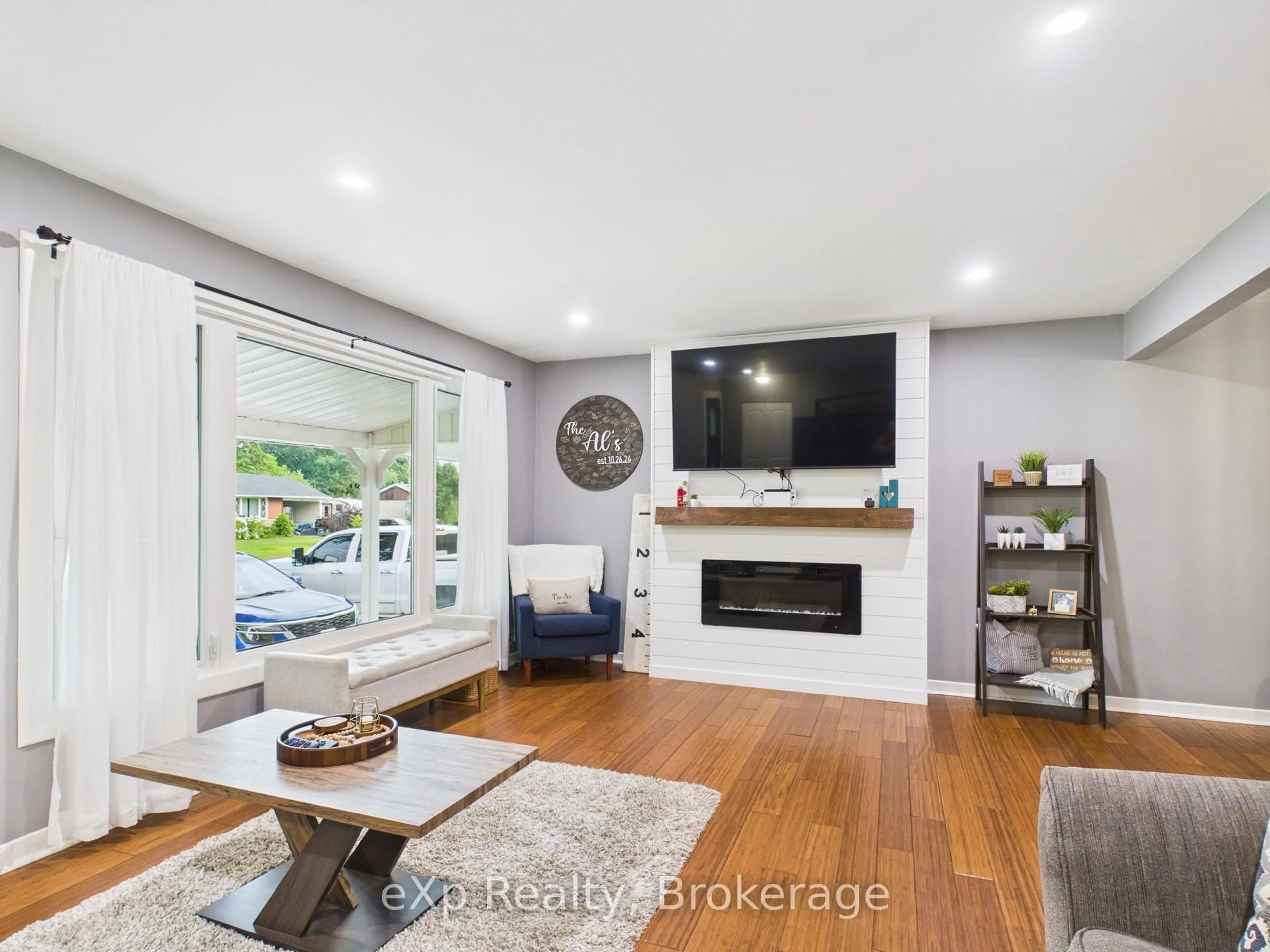 Living room with furniture, wood/laminate floor for 32 Centennial St, Arran-Elderslie Ontario N0G 1L0