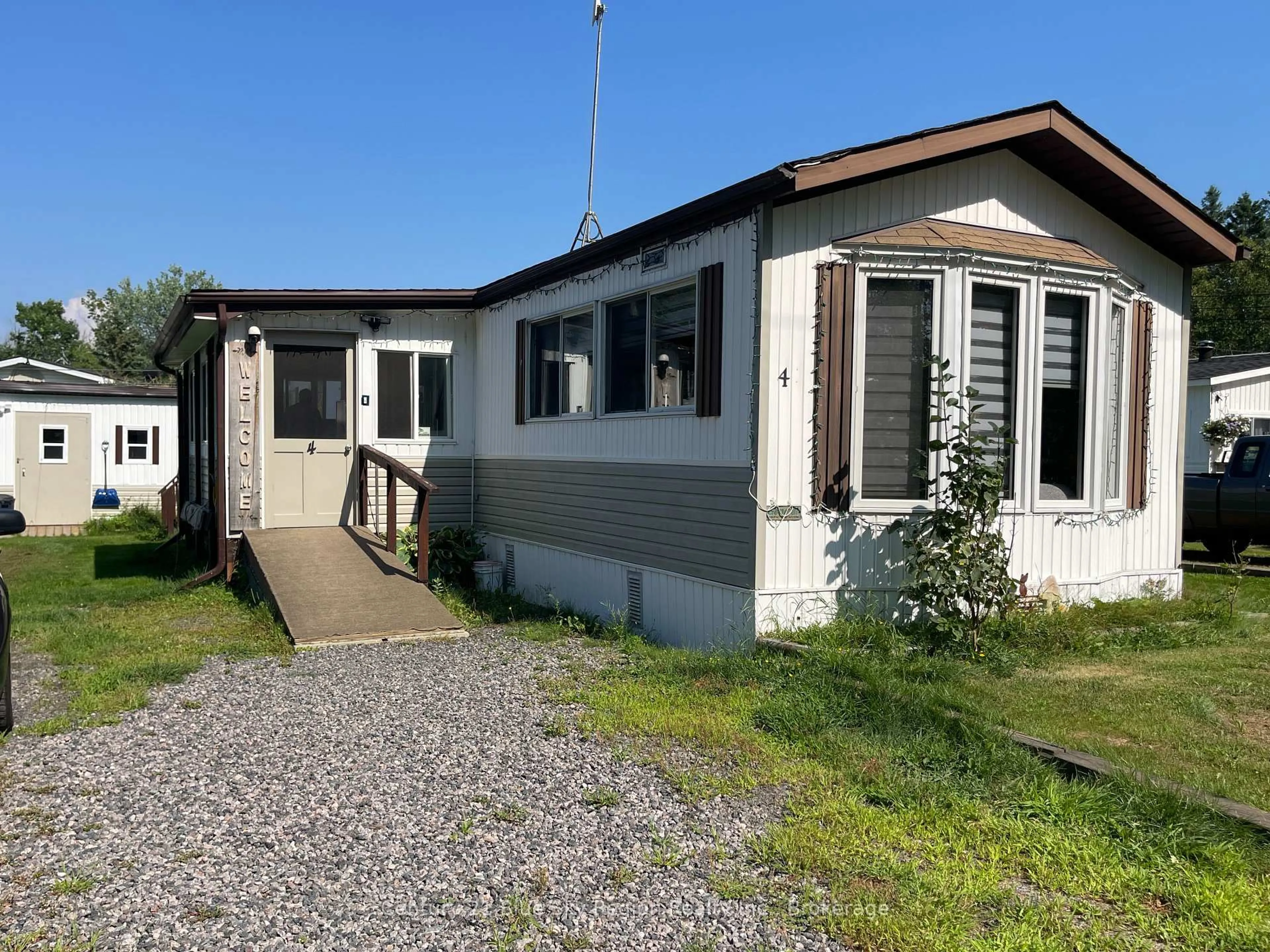 Home with vinyl exterior material, street for 395 RIVERBEND Rd #4, North Bay Ontario P1B 8Z4
