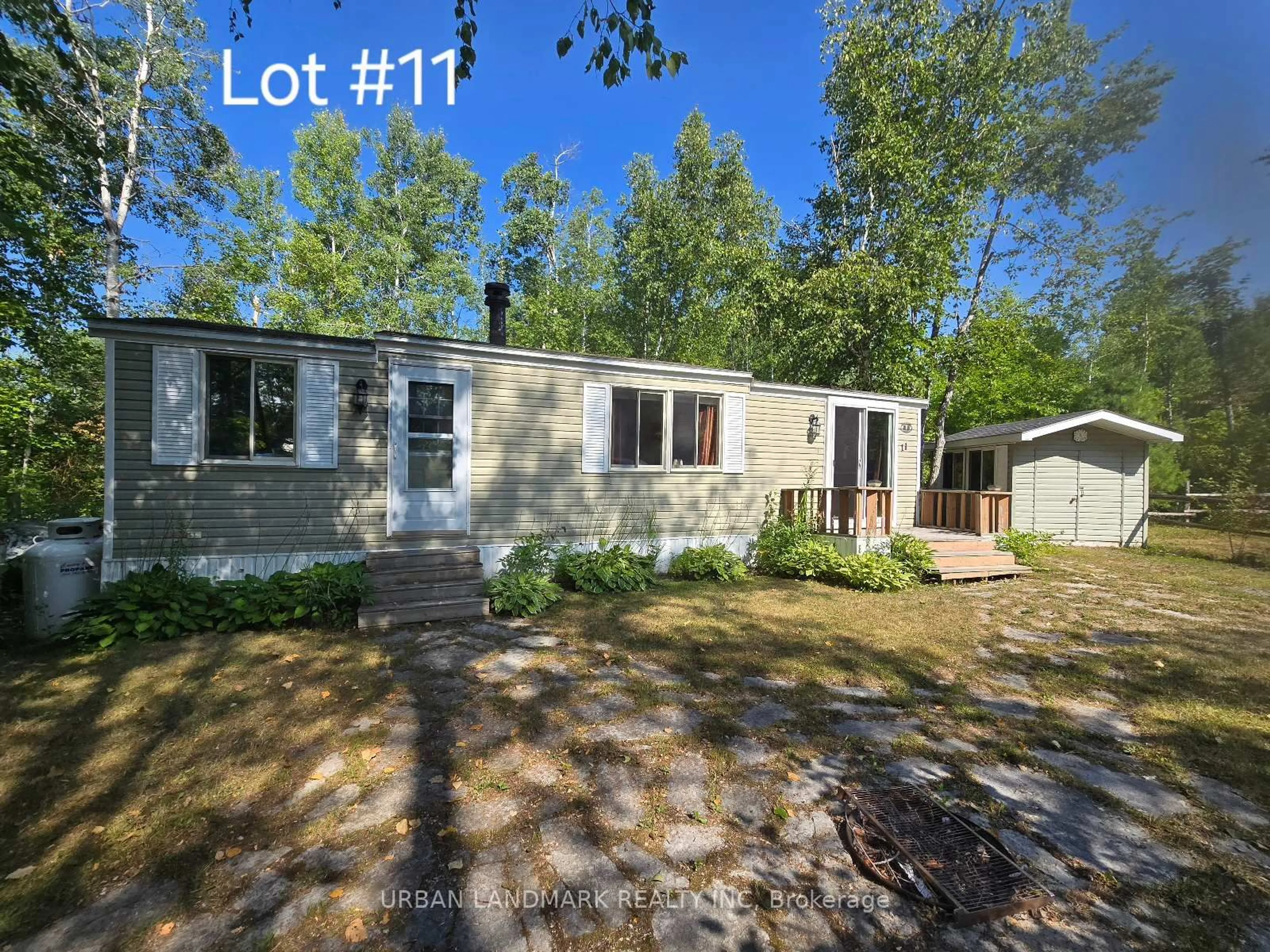 A pic from outside/outdoor area/front of a property/back of a property/a pic from drone, street for 302 Quin Mo Lac Rd, Madoc Ontario K0K 2K0