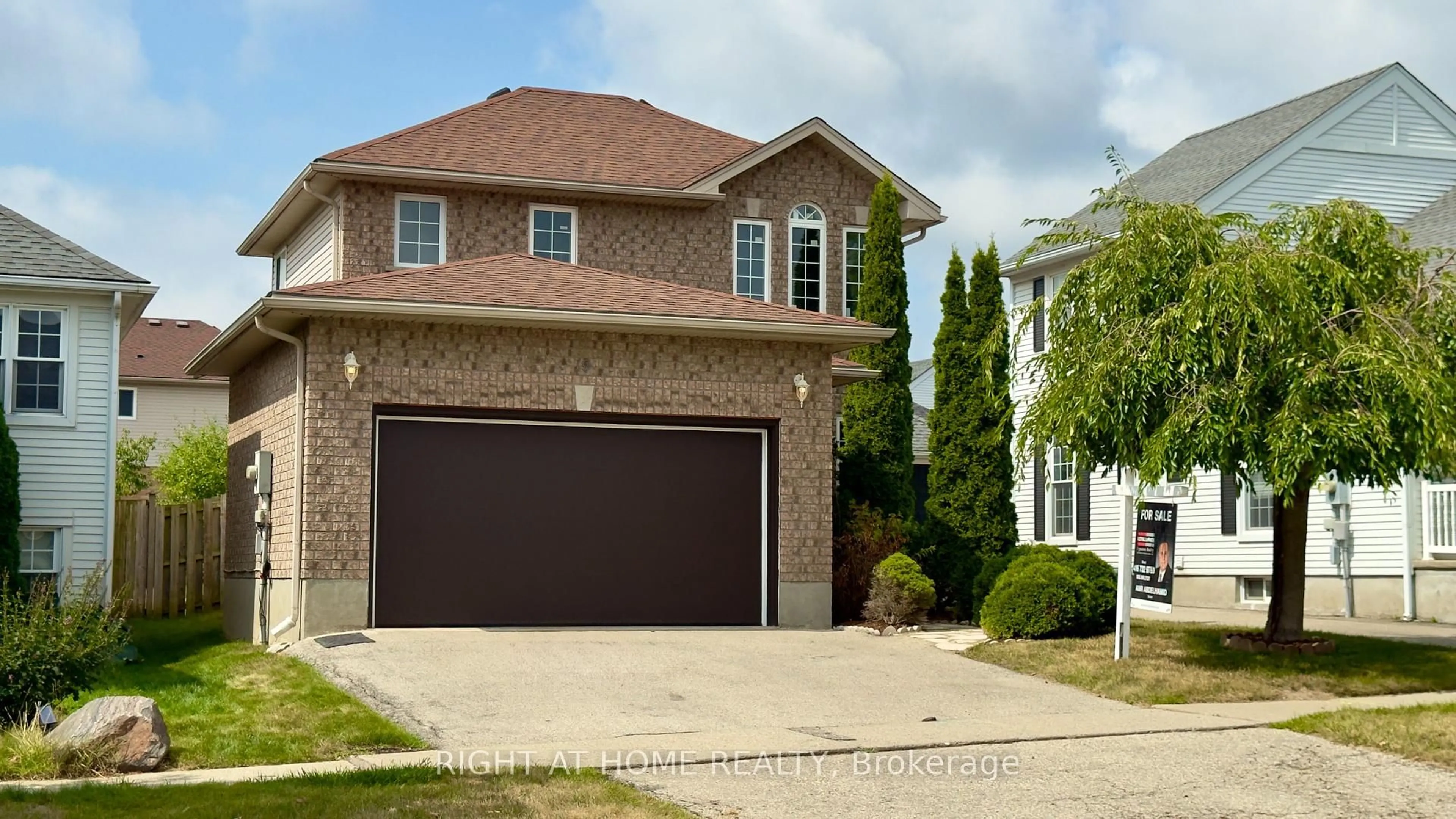 Home with brick exterior material, street for 19 Windflower Dr, Kitchener Ontario N2E 3L3