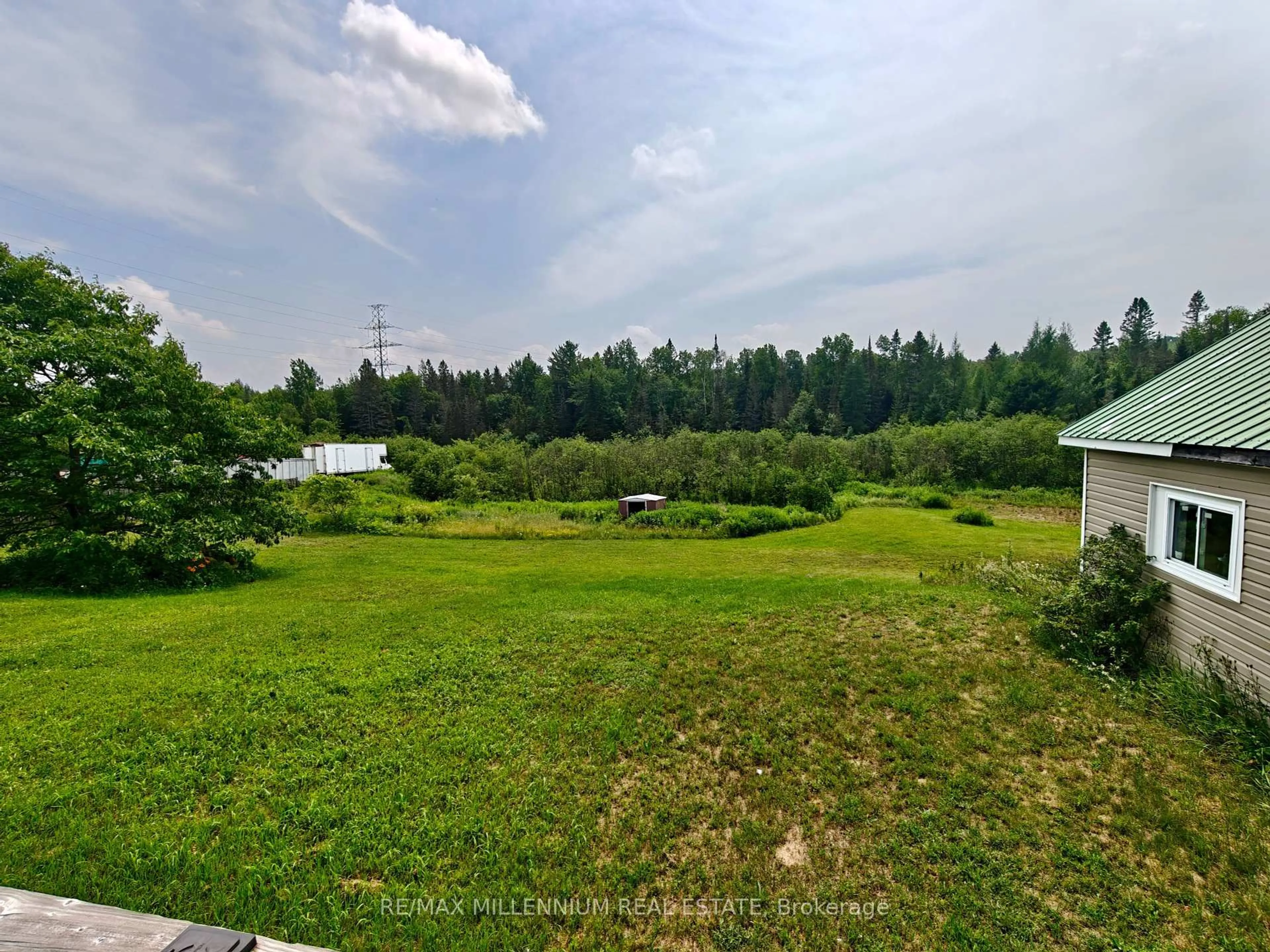 A pic from outside/outdoor area/front of a property/back of a property/a pic from drone, forest/trees view for 1521 Four Mile Lake Rd, North Bay Ontario P1B 8G2