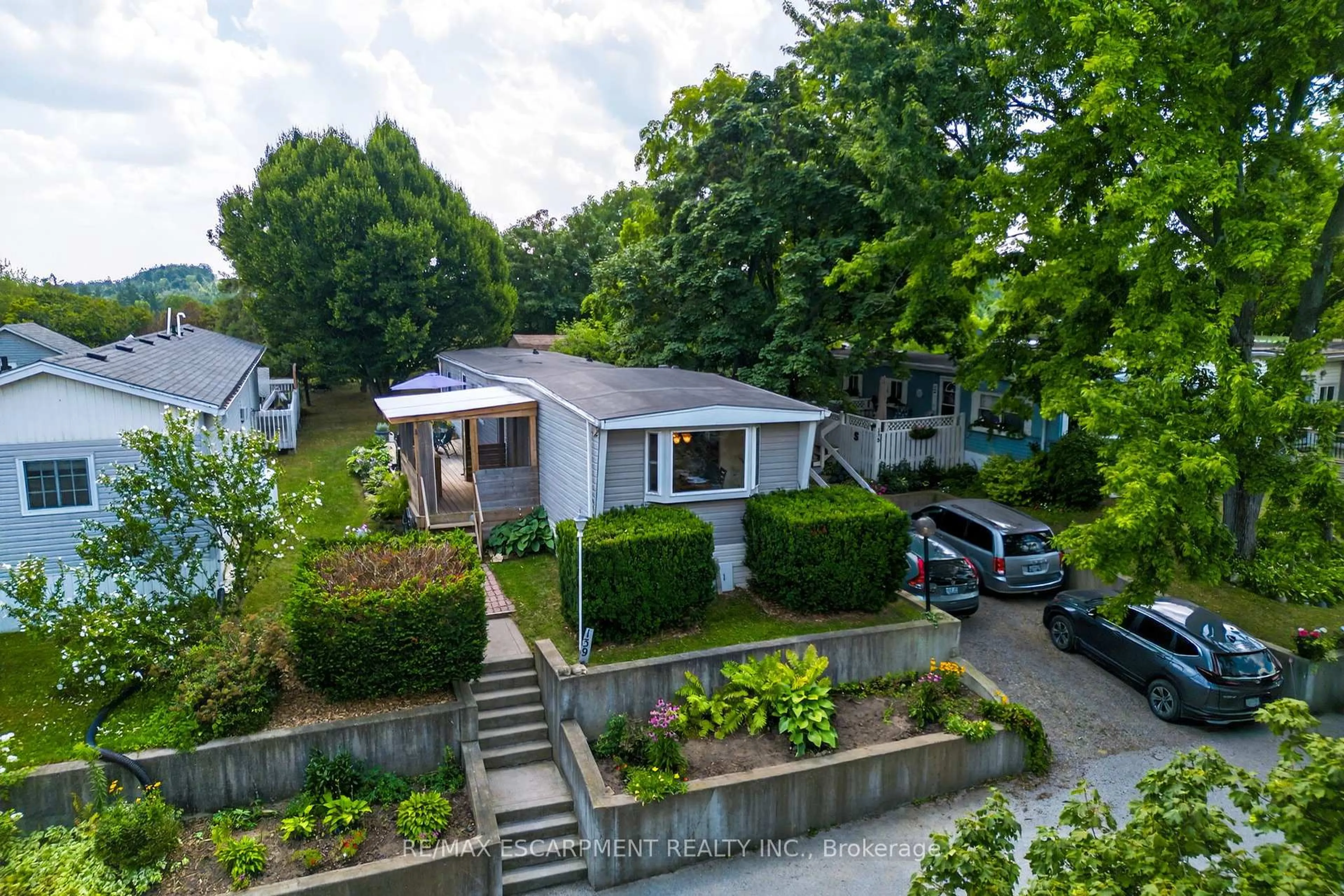A pic from outside/outdoor area/front of a property/back of a property/a pic from drone, street for 1294 Concession 8 Rd #139 Maple Cres, Hamilton Ontario N0B 2J0