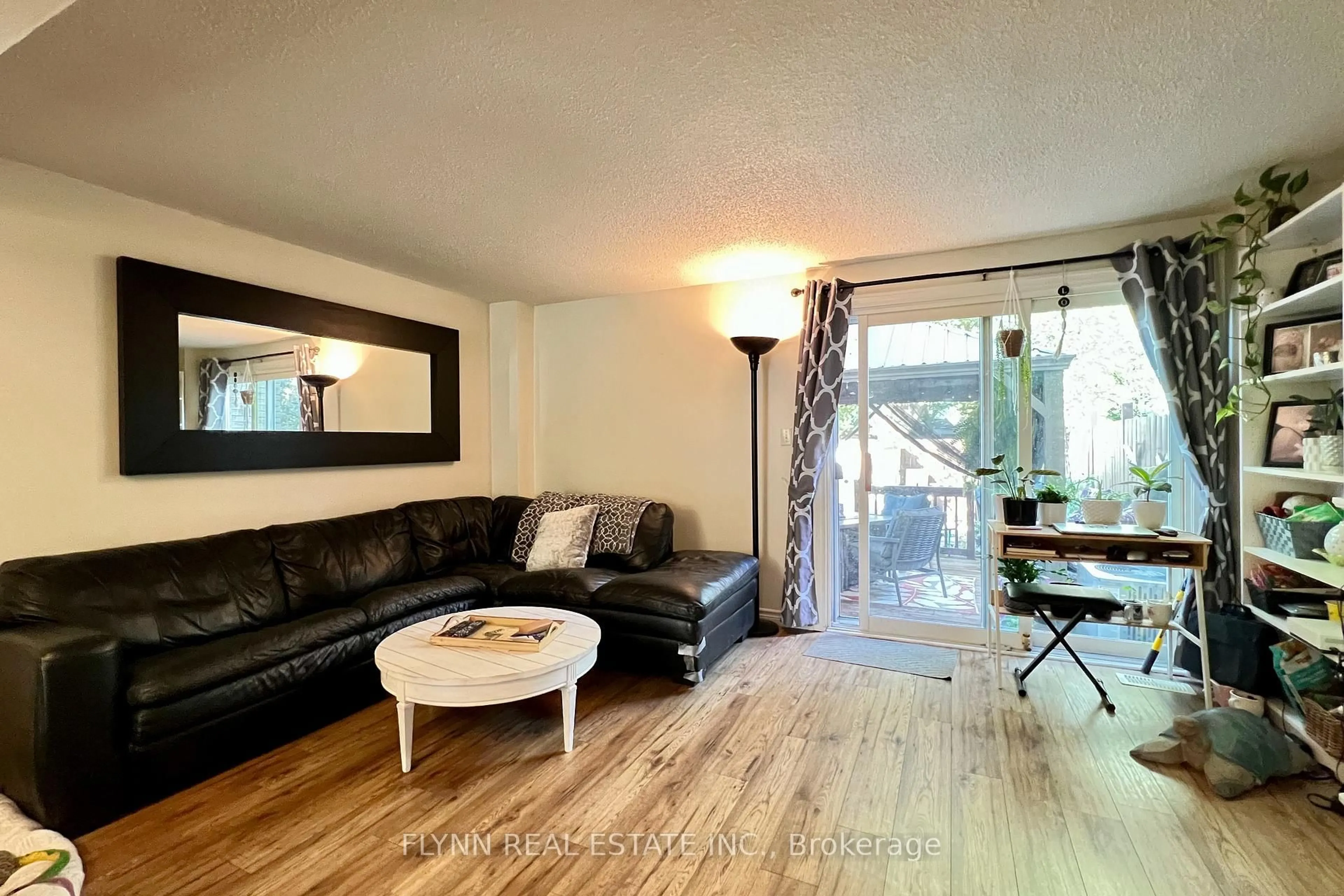 Living room with furniture, wood/laminate floor for 3070 EMPIRE Pl, Niagara Falls Ontario L2J 3L8
