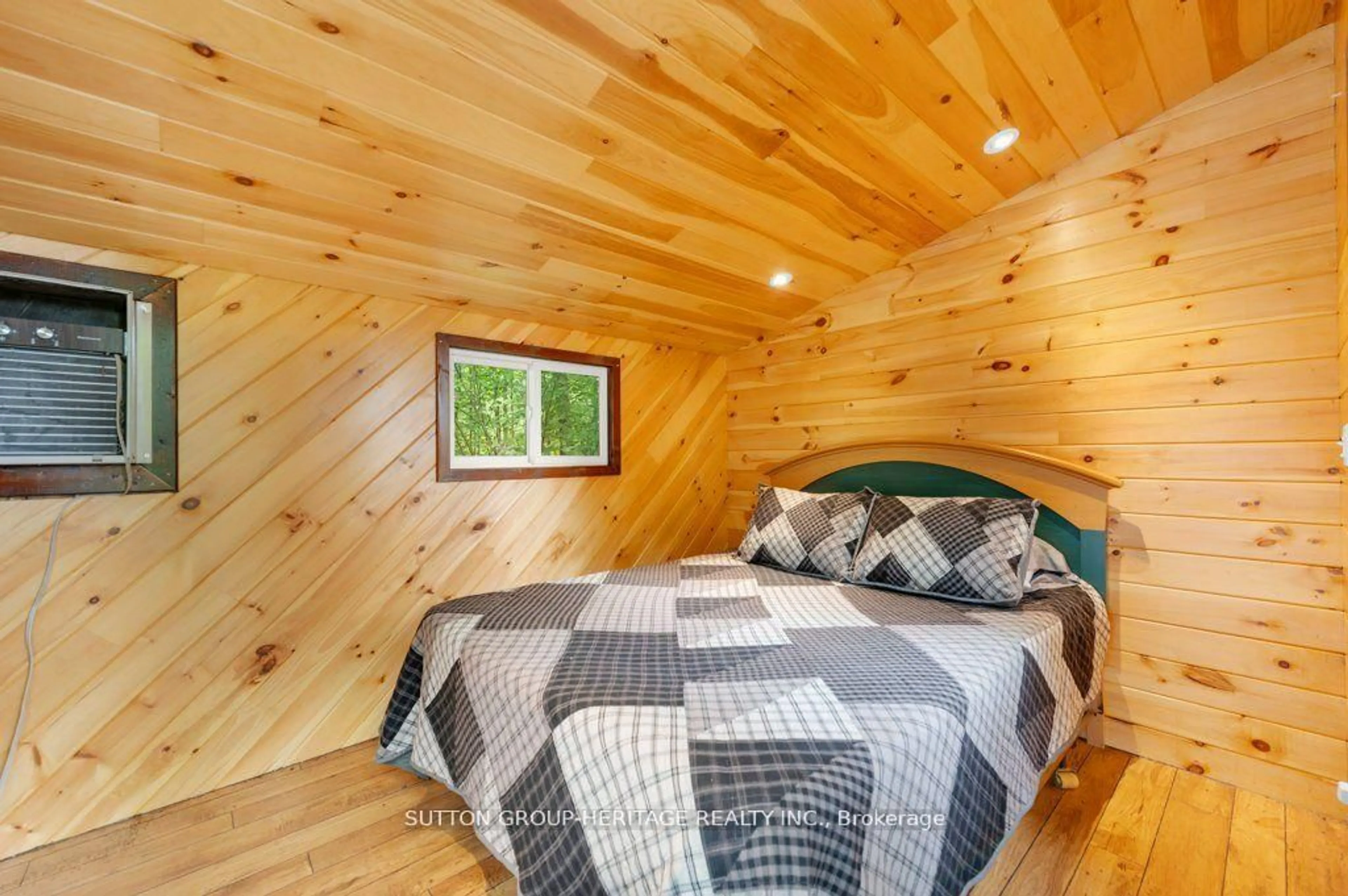 Bedroom with bed, wood/laminate floor for 224 Shoreline Lane, Madoc Ontario K0K 2K0