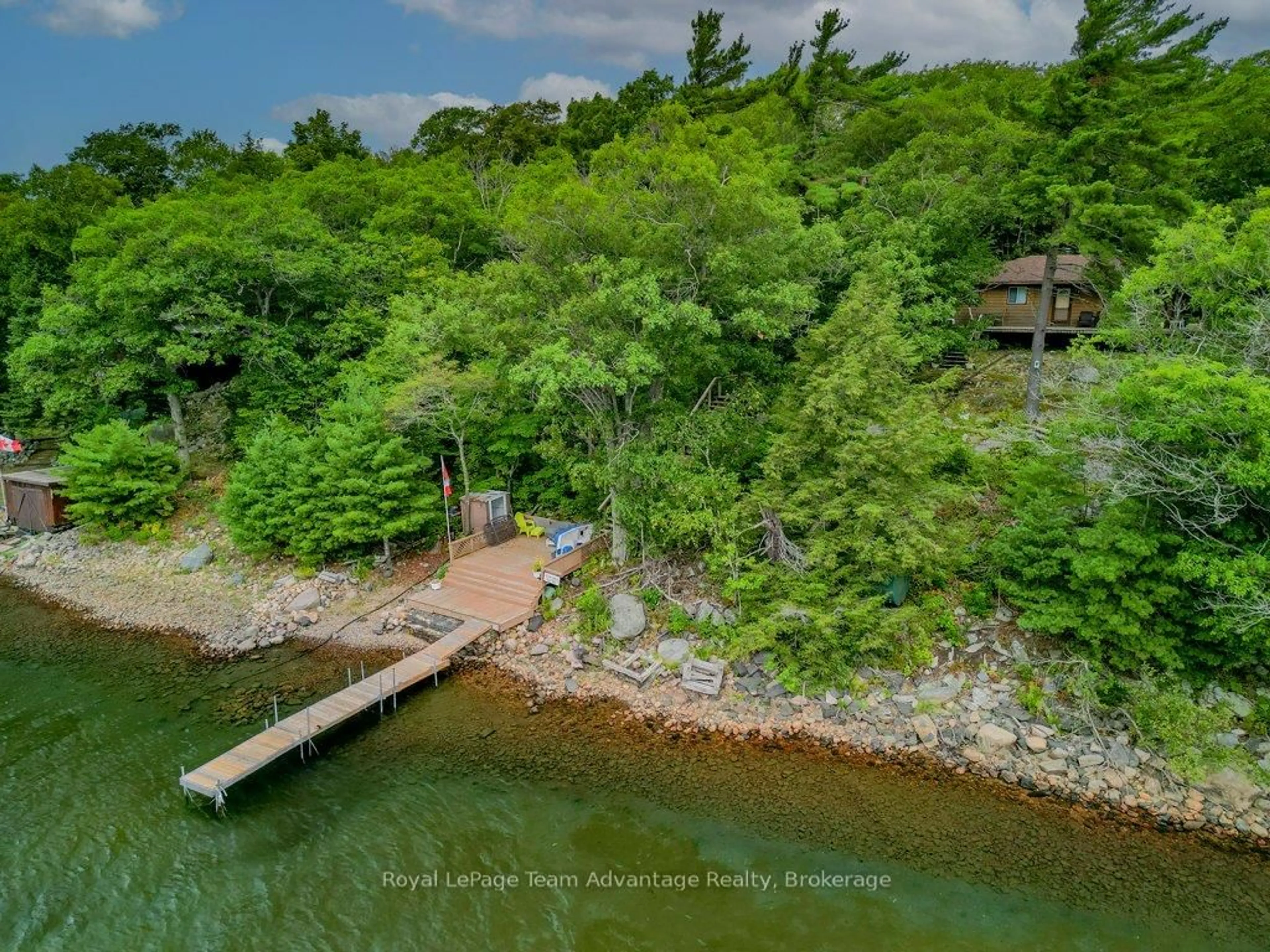 A pic from outside/outdoor area/front of a property/back of a property/a pic from drone, water/lake/river/ocean view for 32 Island 65C, Carling Ontario P0G 1G0
