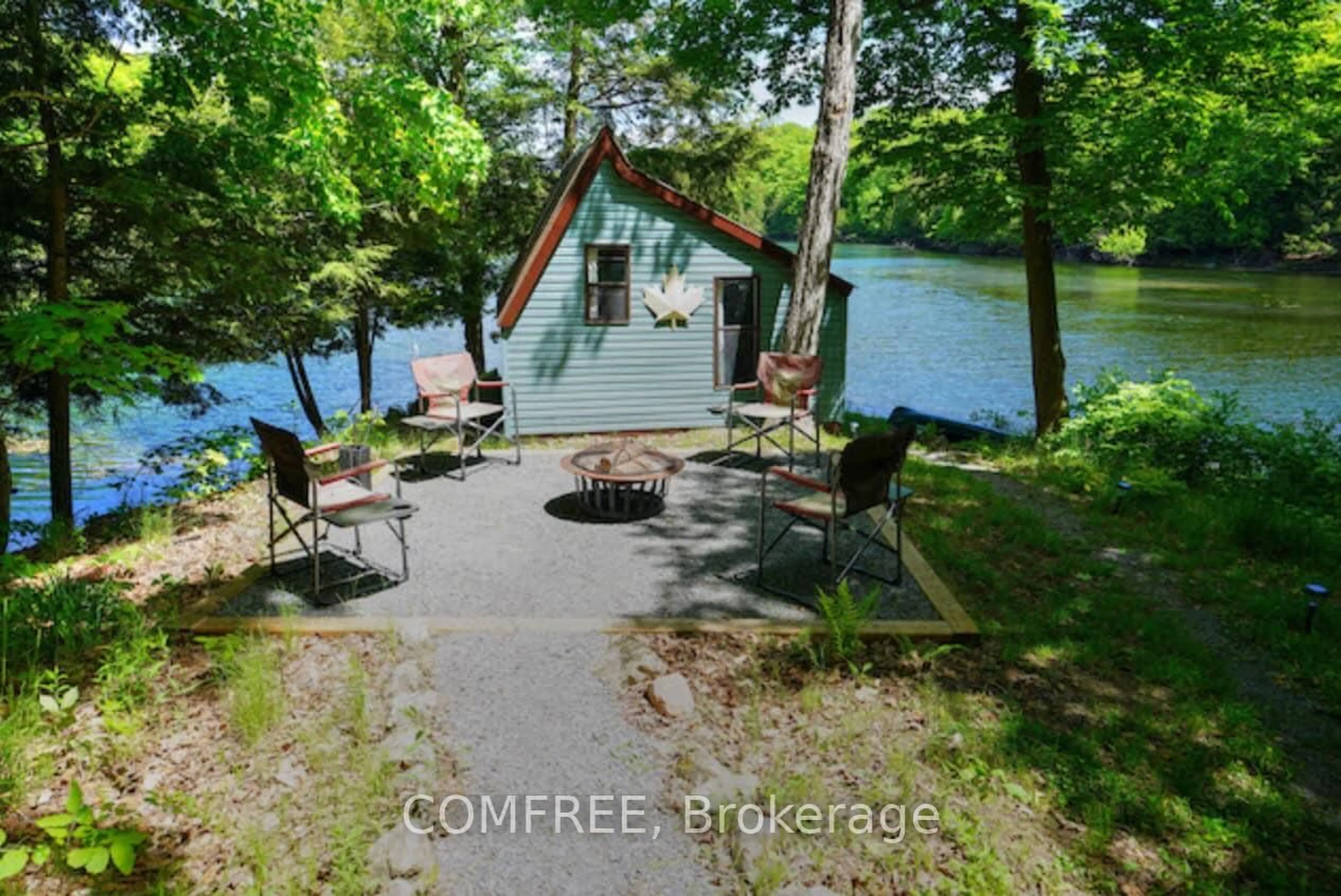 A pic from outside/outdoor area/front of a property/back of a property/a pic from drone, water/lake/river/ocean view for 199 West Devil Lake Lane, Sydenham Ontario K0H 2T0