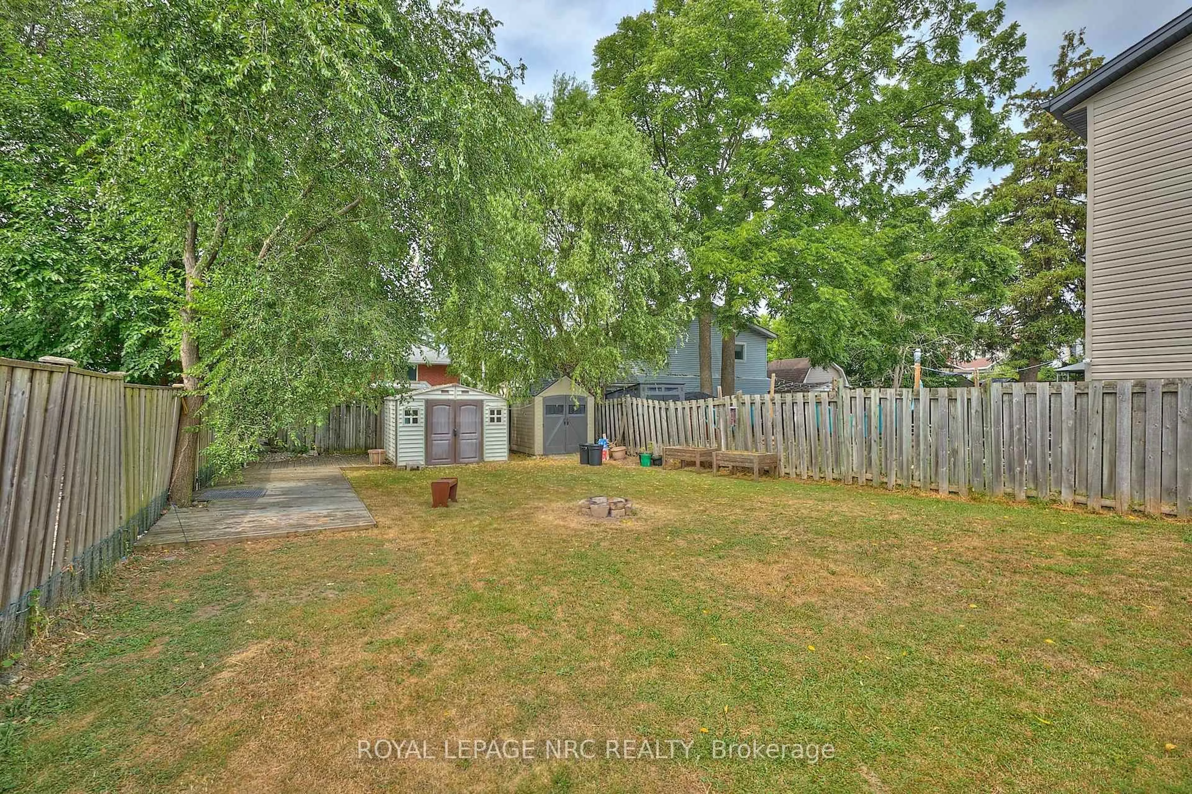 A pic from outside/outdoor area/front of a property/back of a property/a pic from drone, forest/trees view for 8 Woodburn Ave, St. Catharines Ontario L2P 2W7