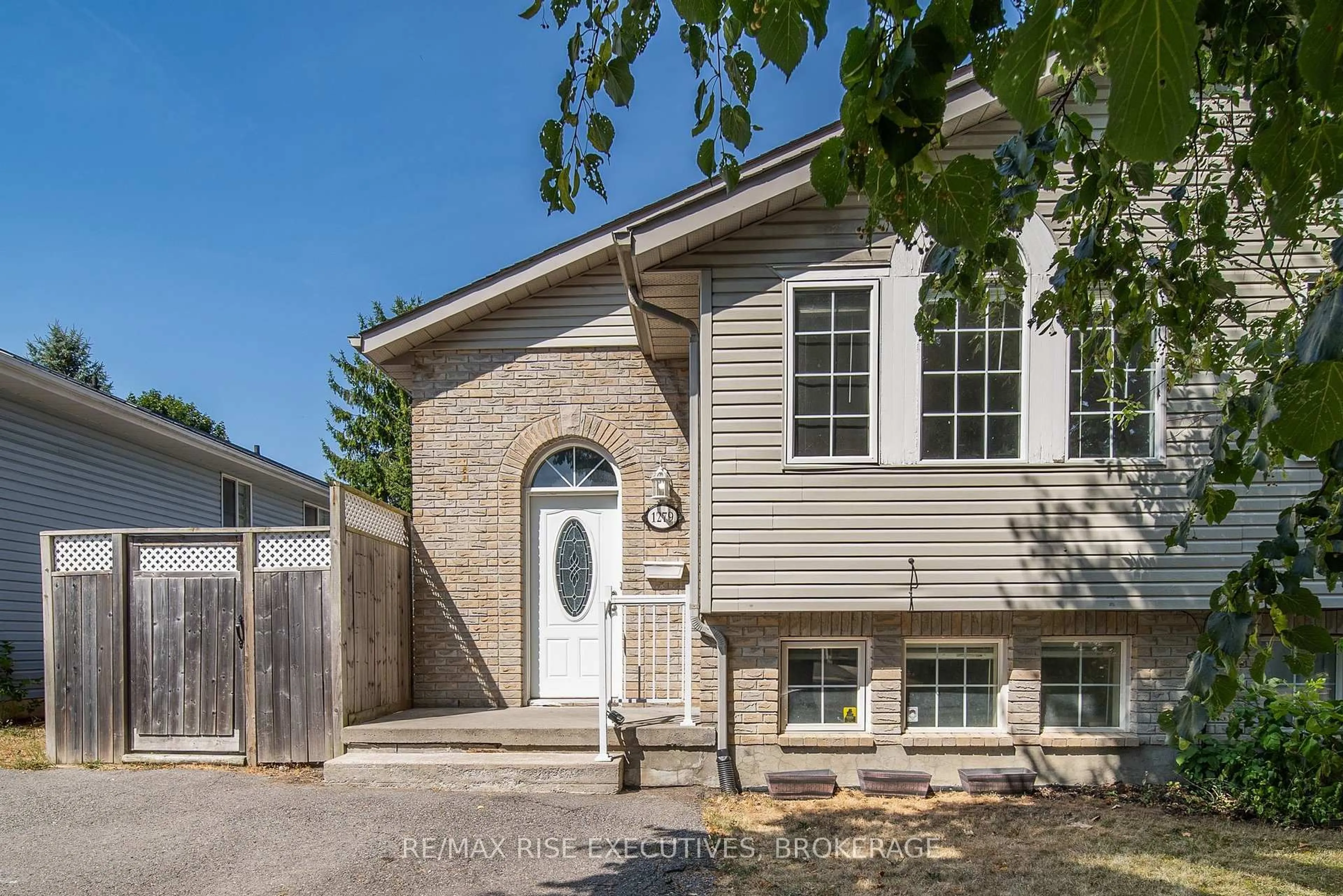 Home with vinyl exterior material, street for 1279 Brackenwood Cres, Kingston Ontario K7P 2W3