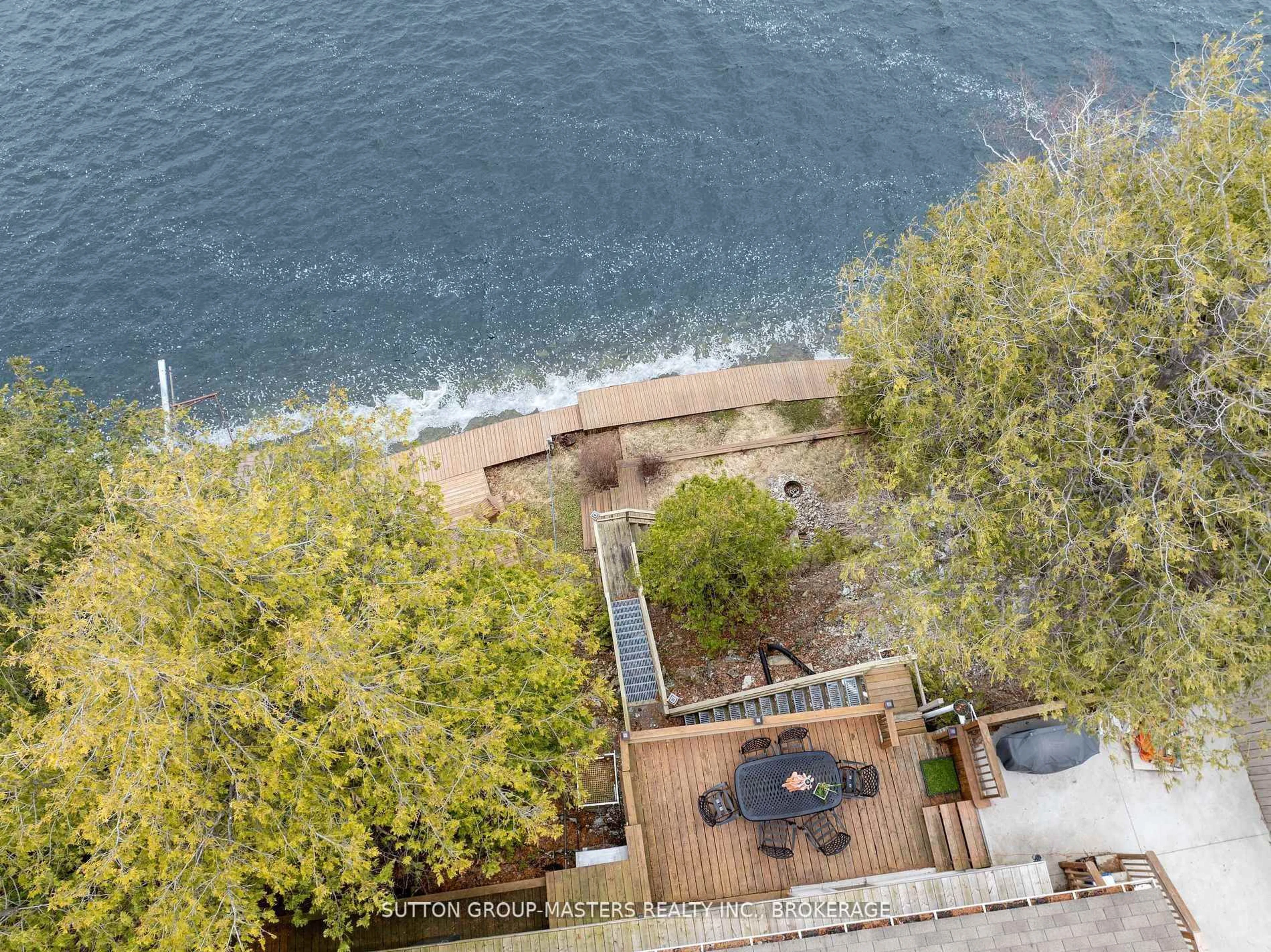 A pic from outside/outdoor area/front of a property/back of a property/a pic from drone, water/lake/river/ocean view for 4496 Red Maple Lane, Inverary Ontario K0H 1X0