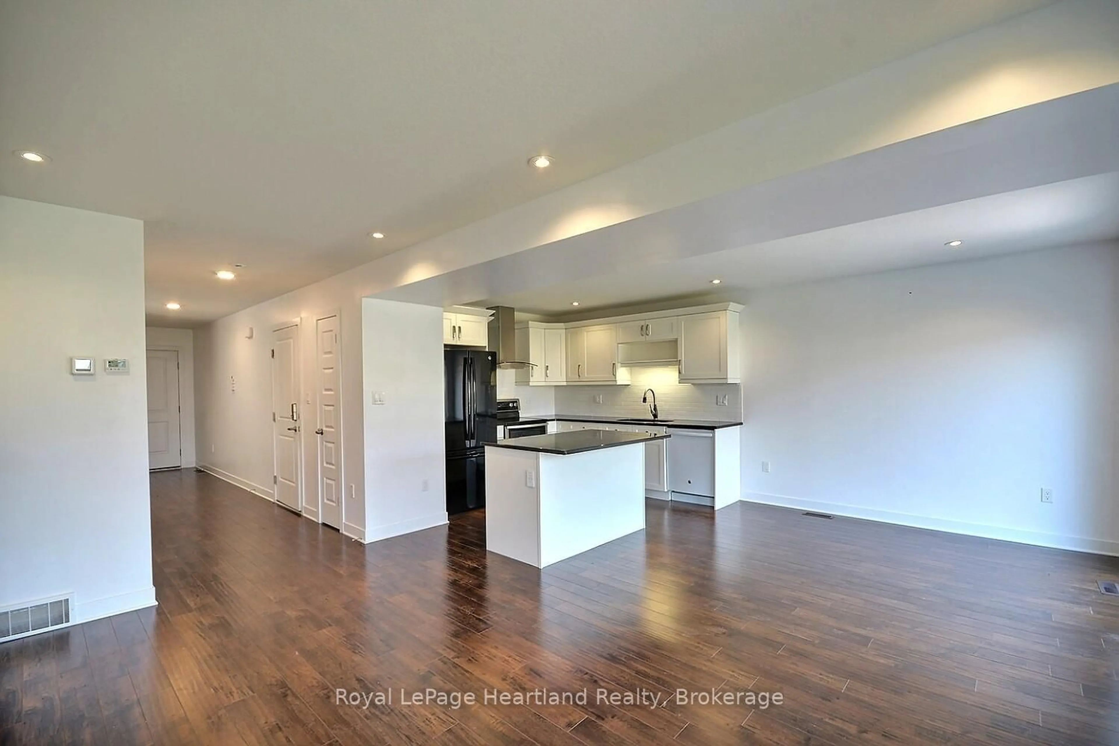 Open concept kitchen, wood/laminate floor for 371 BEECH St, Lucan Biddulph Ontario N0M 2J0