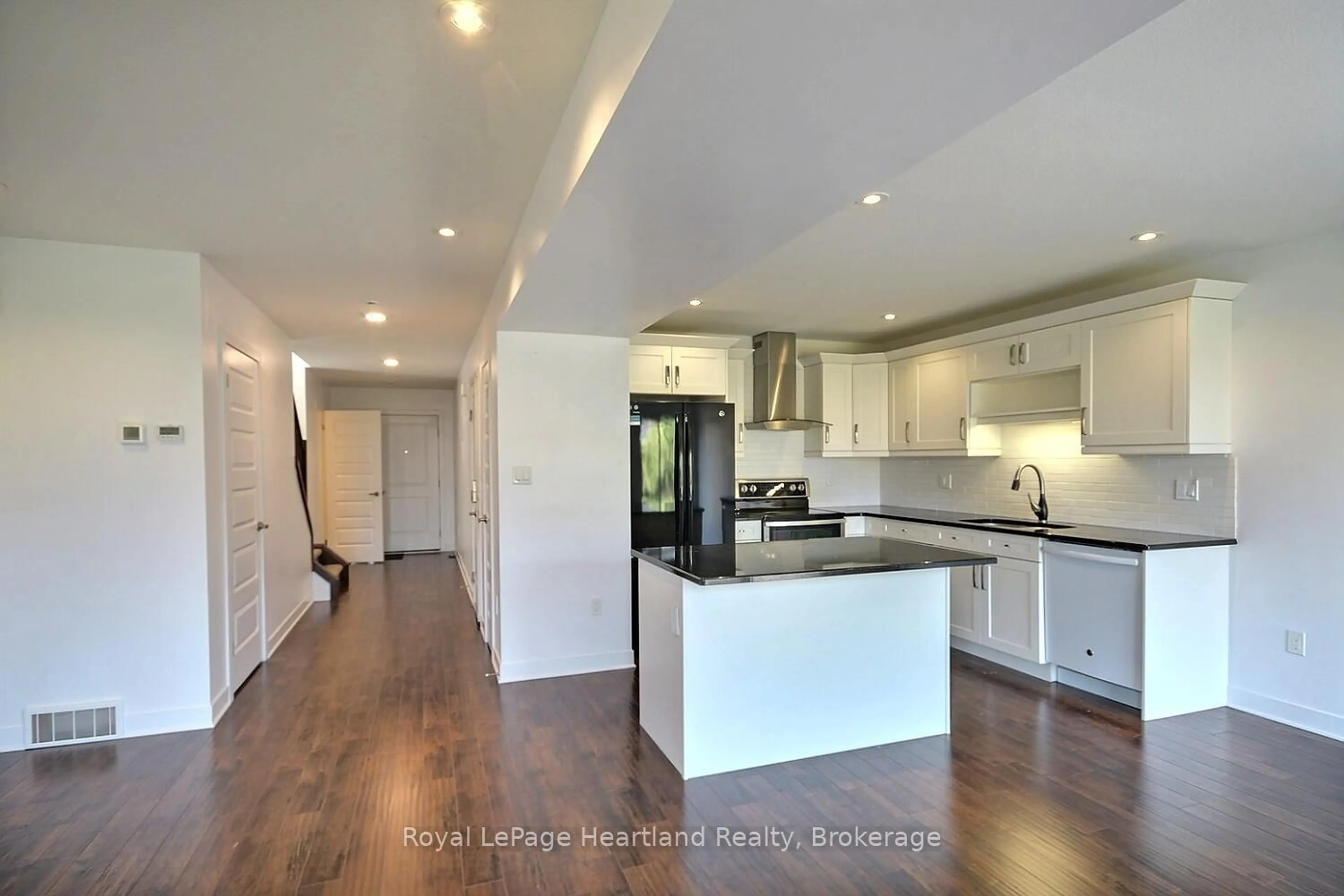 Open concept kitchen, wood/laminate floor for 371 BEECH St, Lucan Biddulph Ontario N0M 2J0