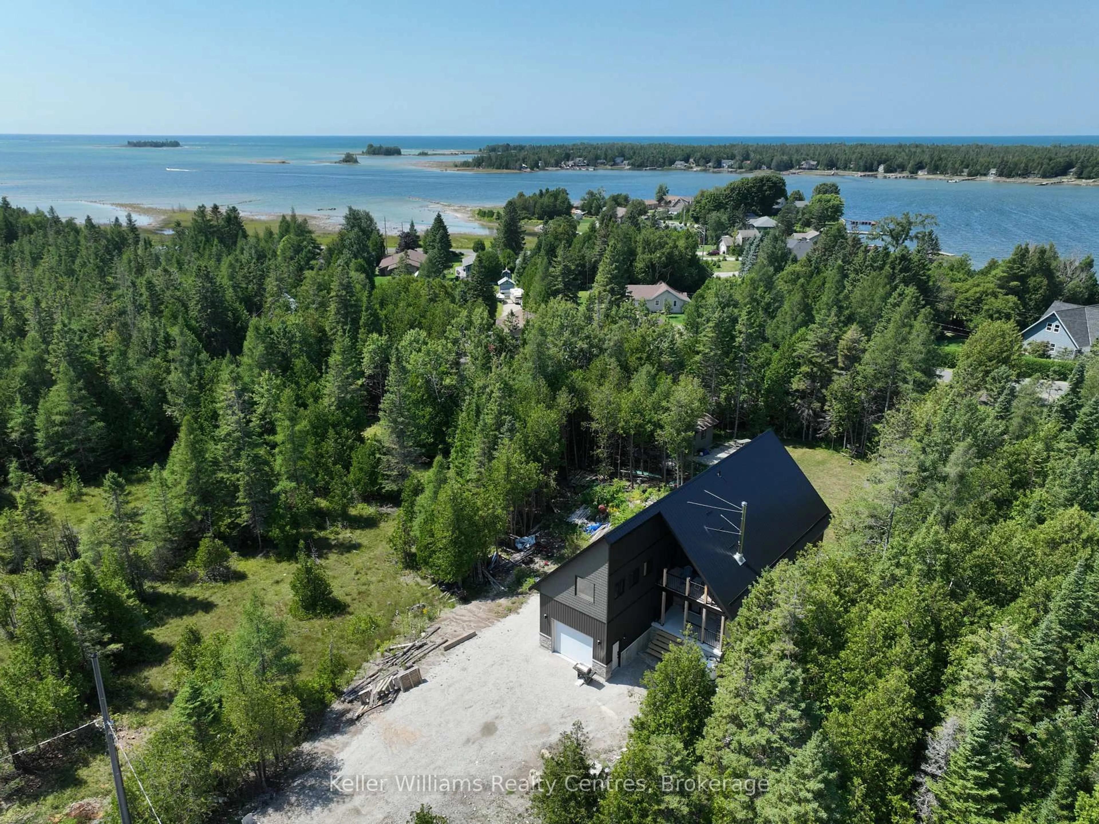 A pic from outside/outdoor area/front of a property/back of a property/a pic from drone, water/lake/river/ocean view for 64 Baywatch Dr, Northern Bruce Peninsula Ontario N0H 2T0