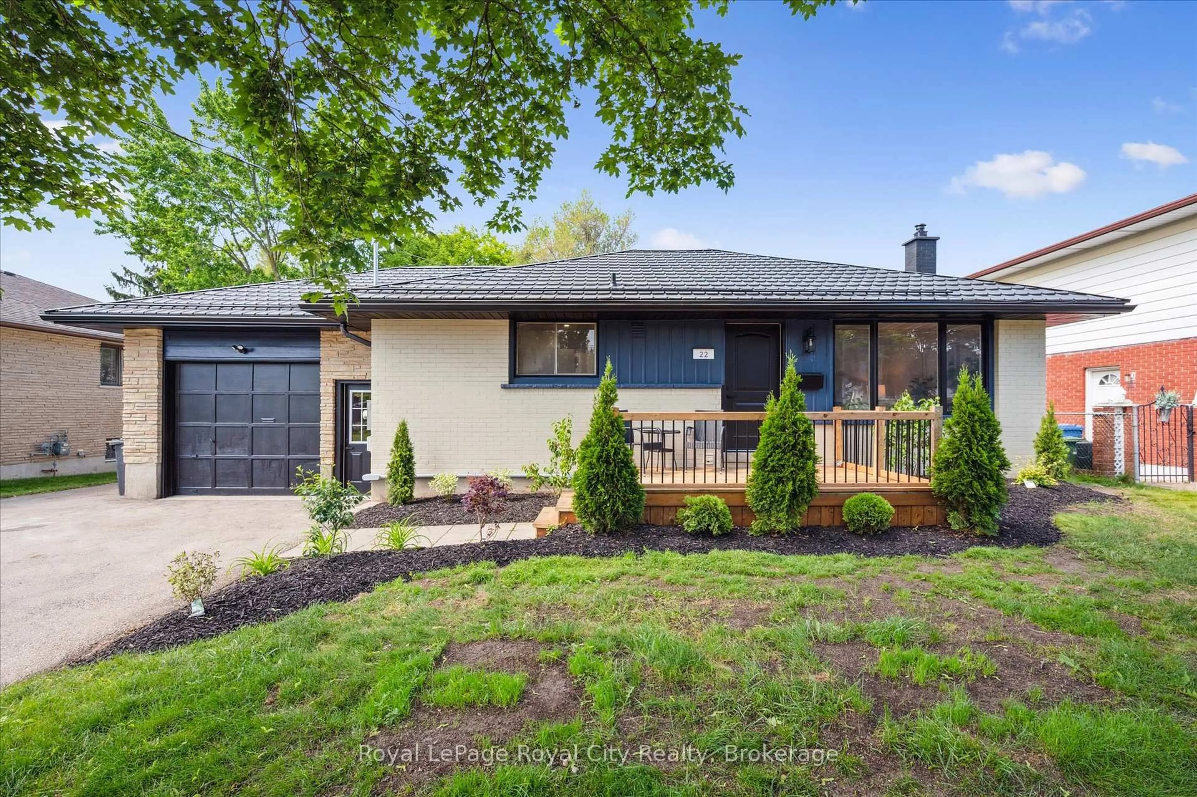 Home with brick exterior material, street for 22 Heath Rd, Guelph Ontario N1H 6G9