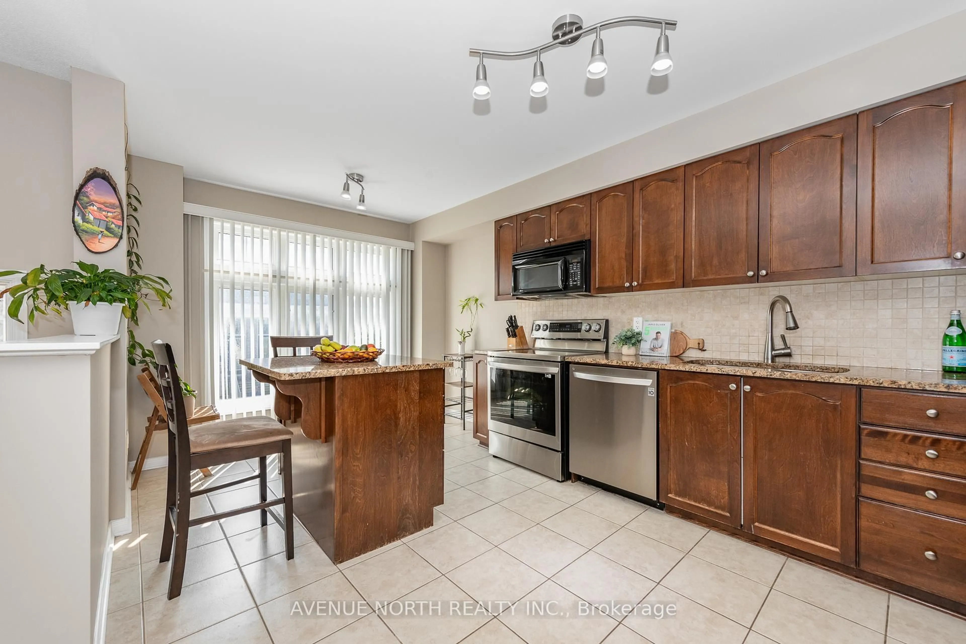 Open concept kitchen, ceramic/tile floor for 283 Stroget Private, Ottawa Ontario K2E 0A9