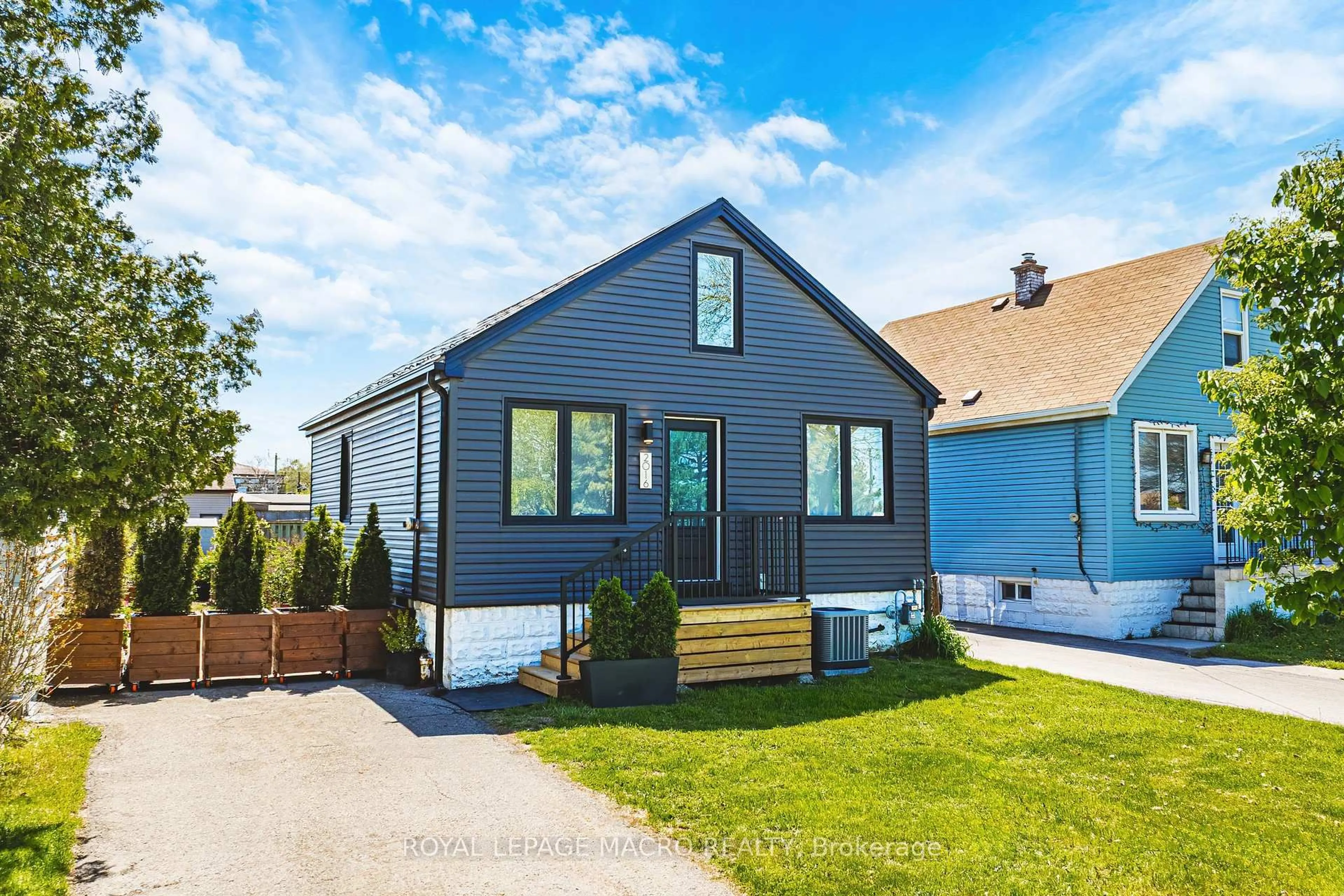 Home with vinyl exterior material, street for 2016 Barton St, Hamilton Ontario L8H 2Y8