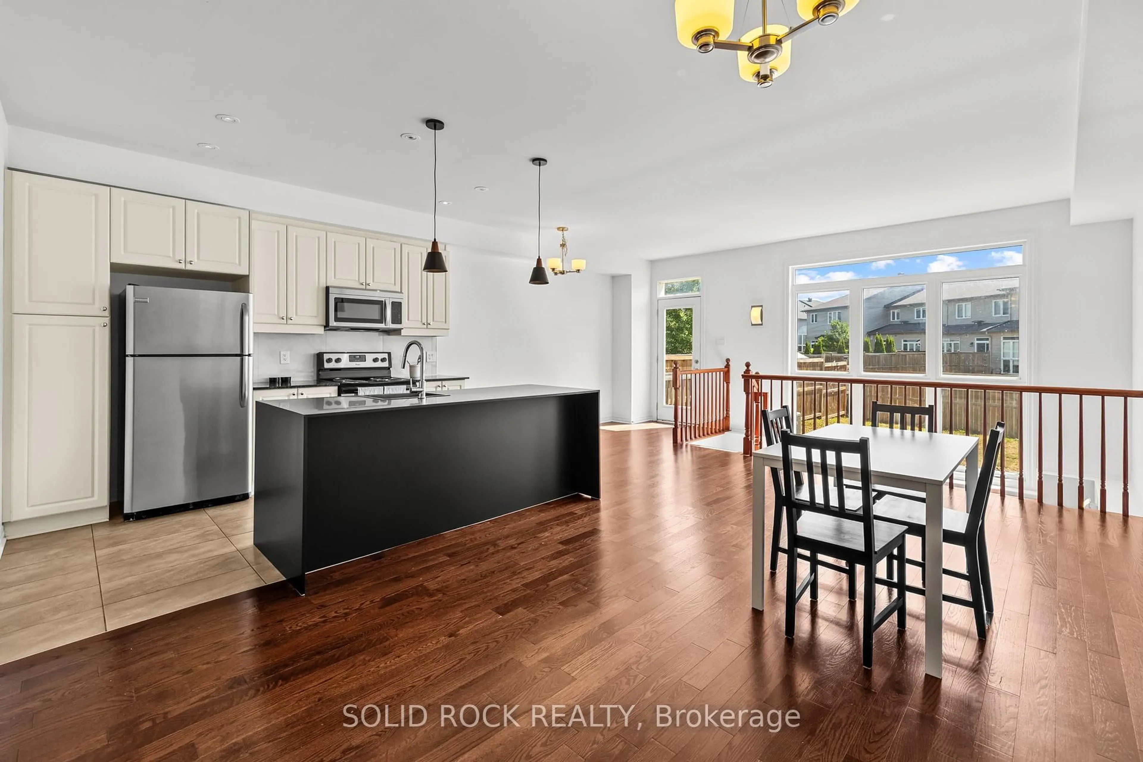 Open concept kitchen, wood/laminate floor for 153 Hawkshaw Cres, Ottawa Ontario K2J 5P8