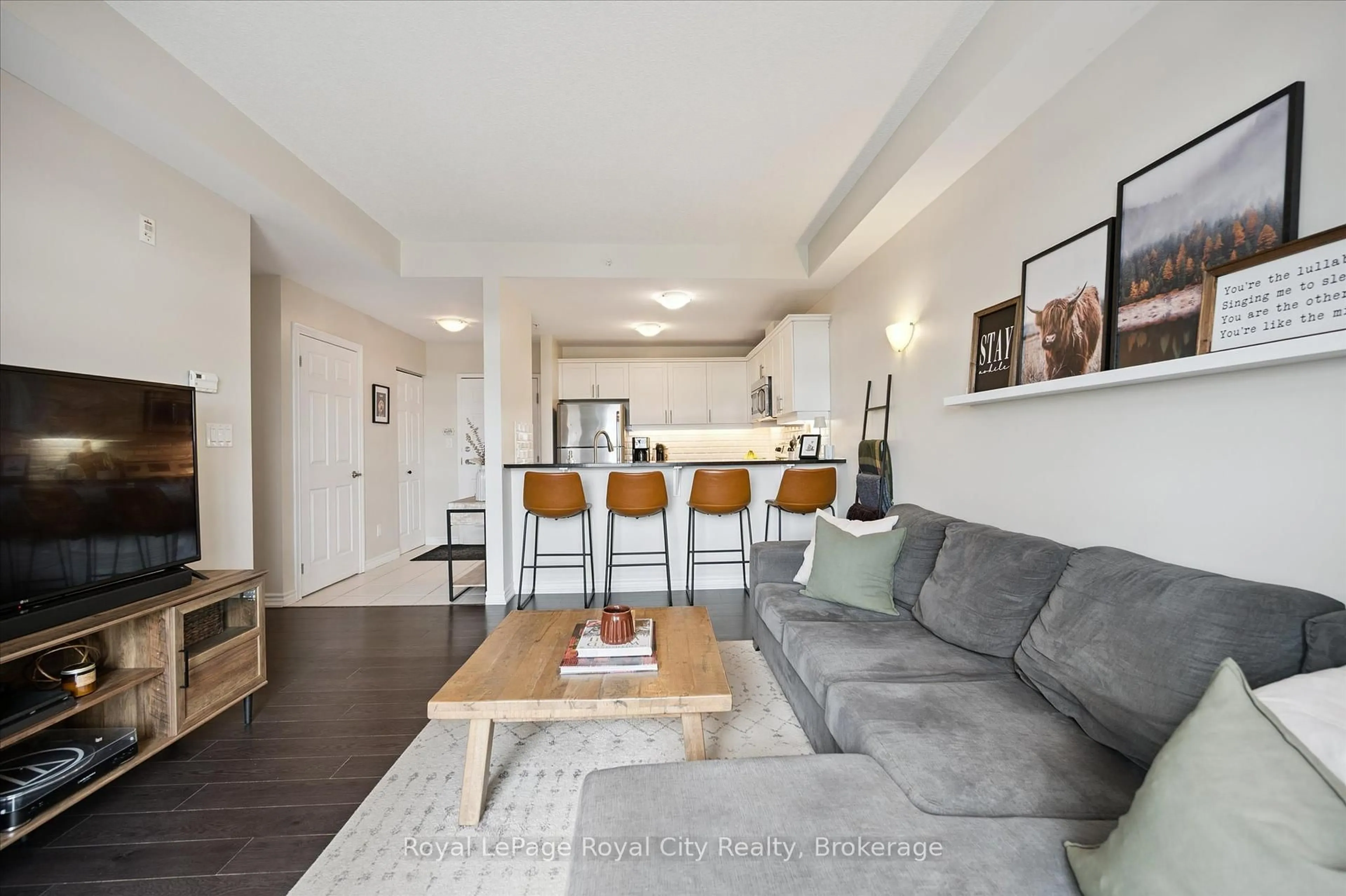 Living room with furniture, wood/laminate floor for 2 Colonial Dr #403, Guelph Ontario N1L 0K8