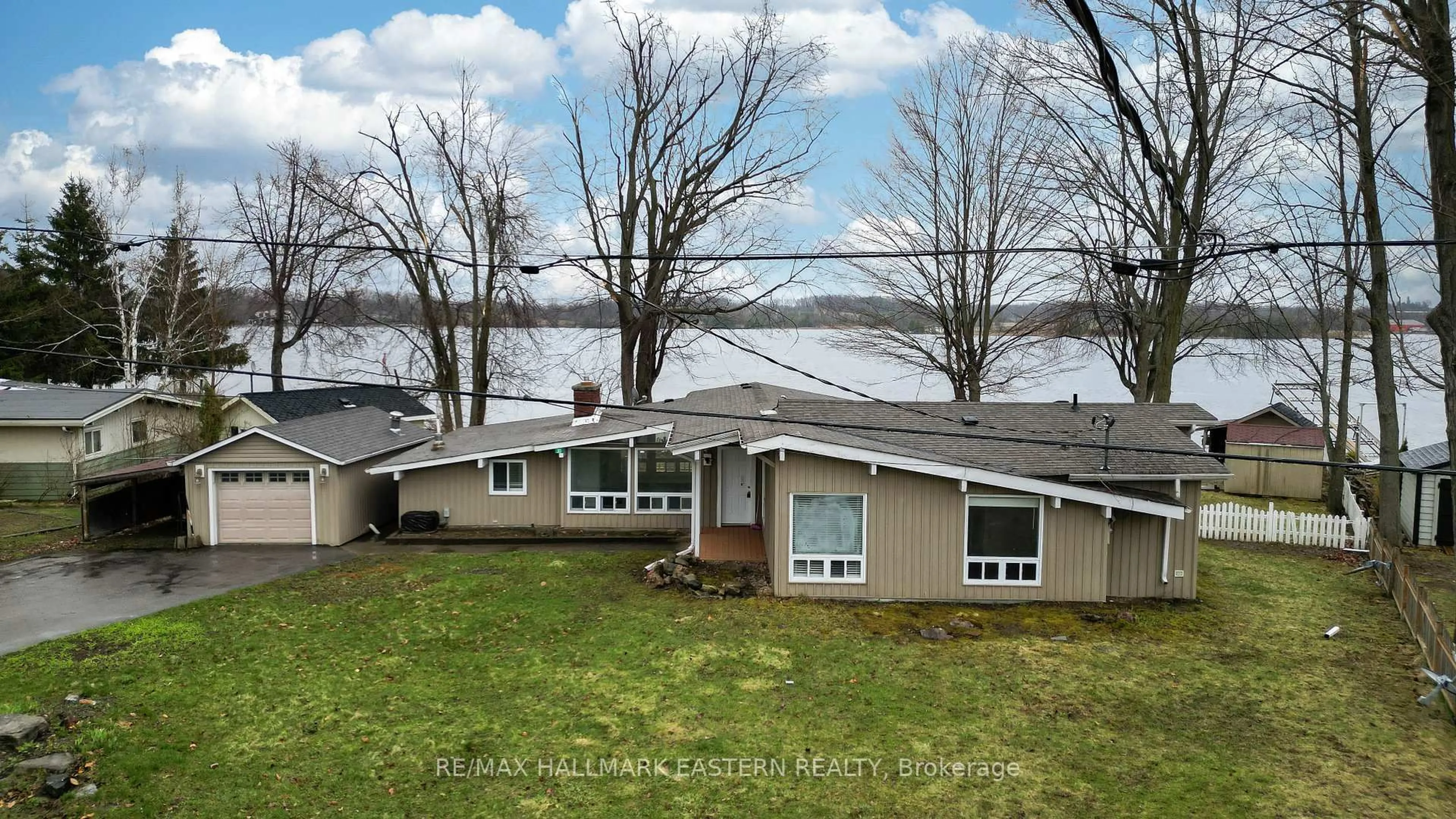 A pic from outside/outdoor area/front of a property/back of a property/a pic from drone, water/lake/river/ocean view for 30 Edgewater Dr, Selwyn Ontario K0L 1T0