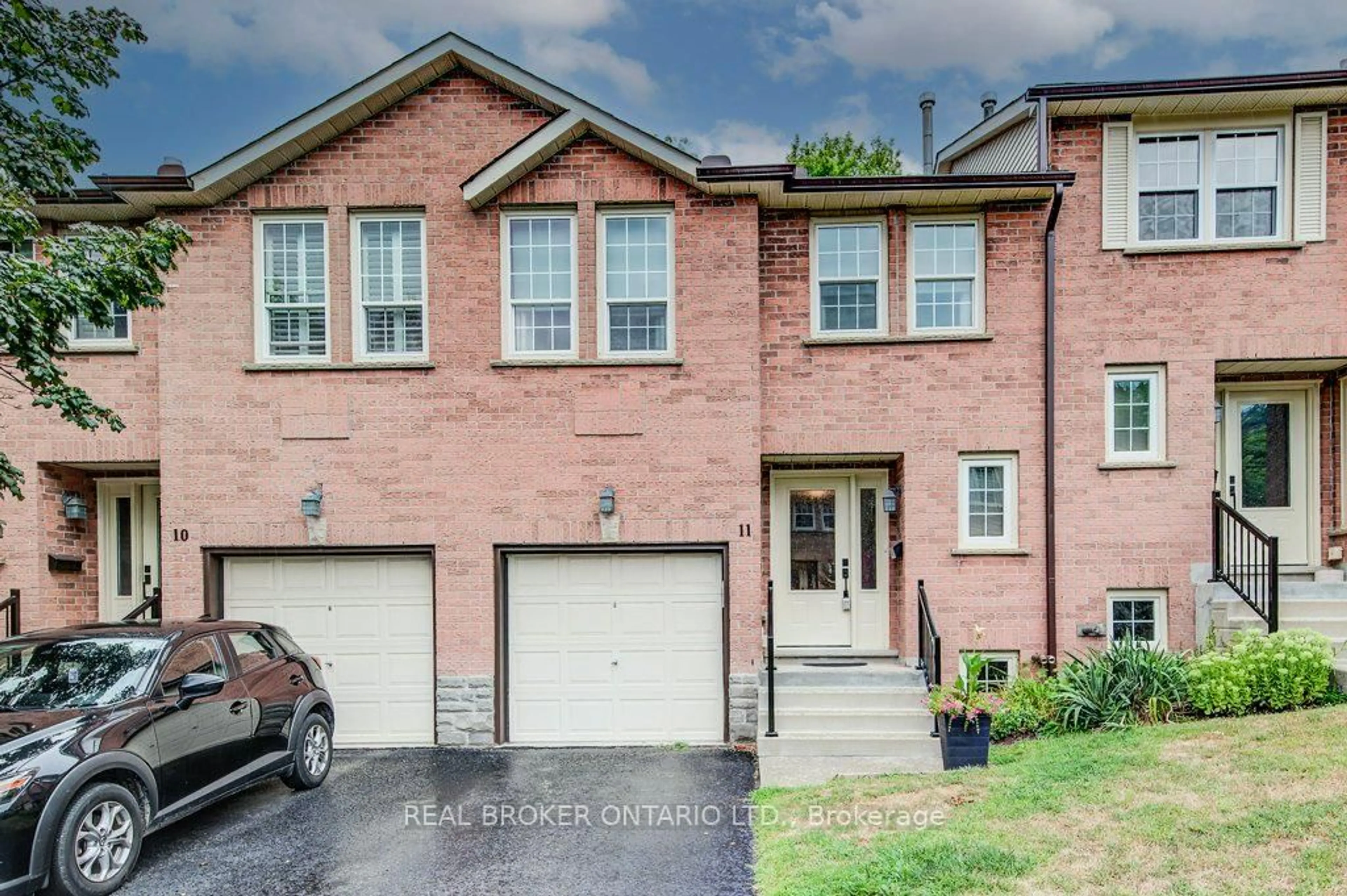 Home with brick exterior material, street for 375 HOLIDAY INN Dr #11, Cambridge Ontario N3C 3P6