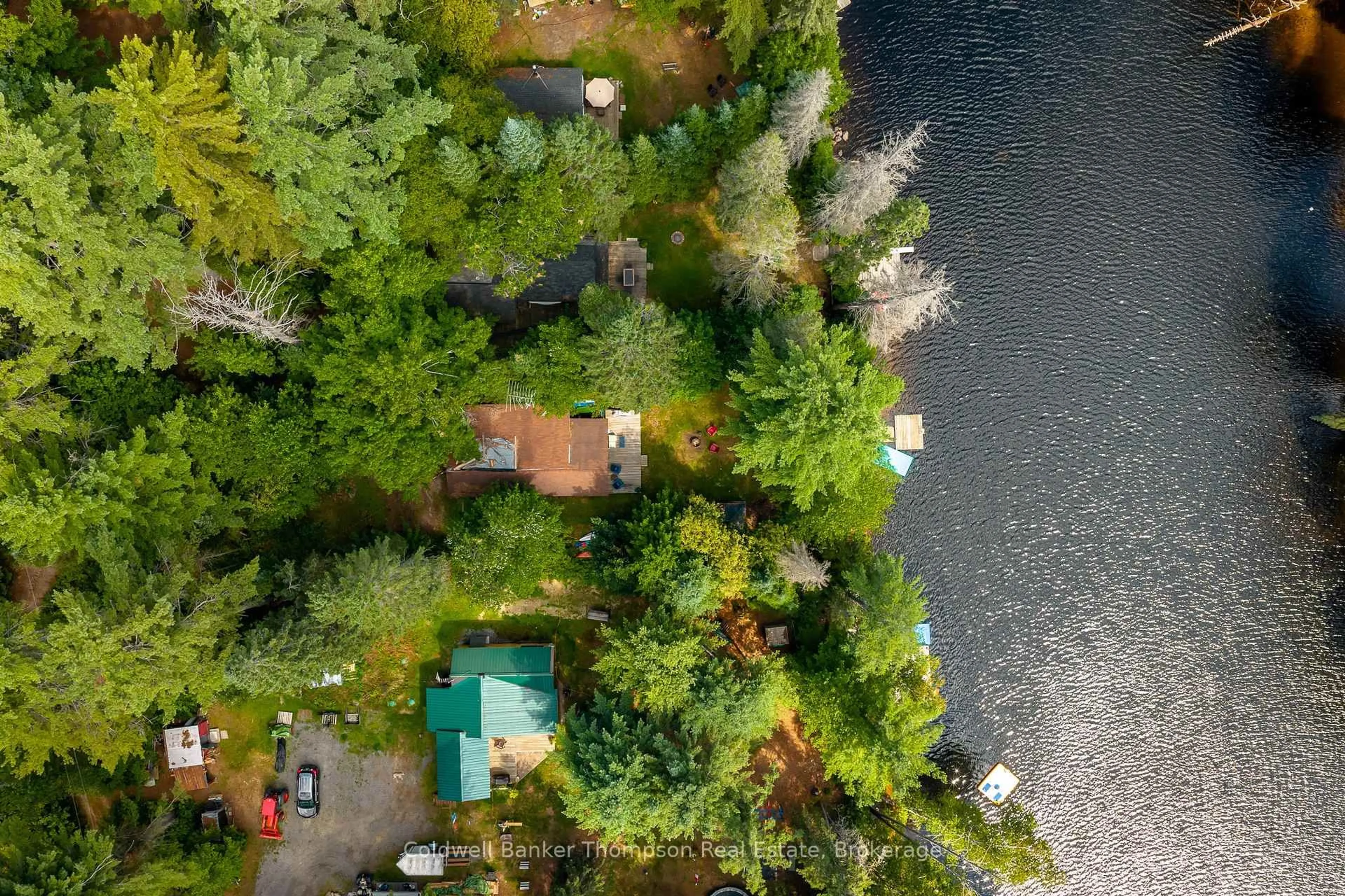 A pic from outside/outdoor area/front of a property/back of a property/a pic from drone, water/lake/river/ocean view for 132 Muskoka River Rd, Huntsville Ontario P0B 1L0
