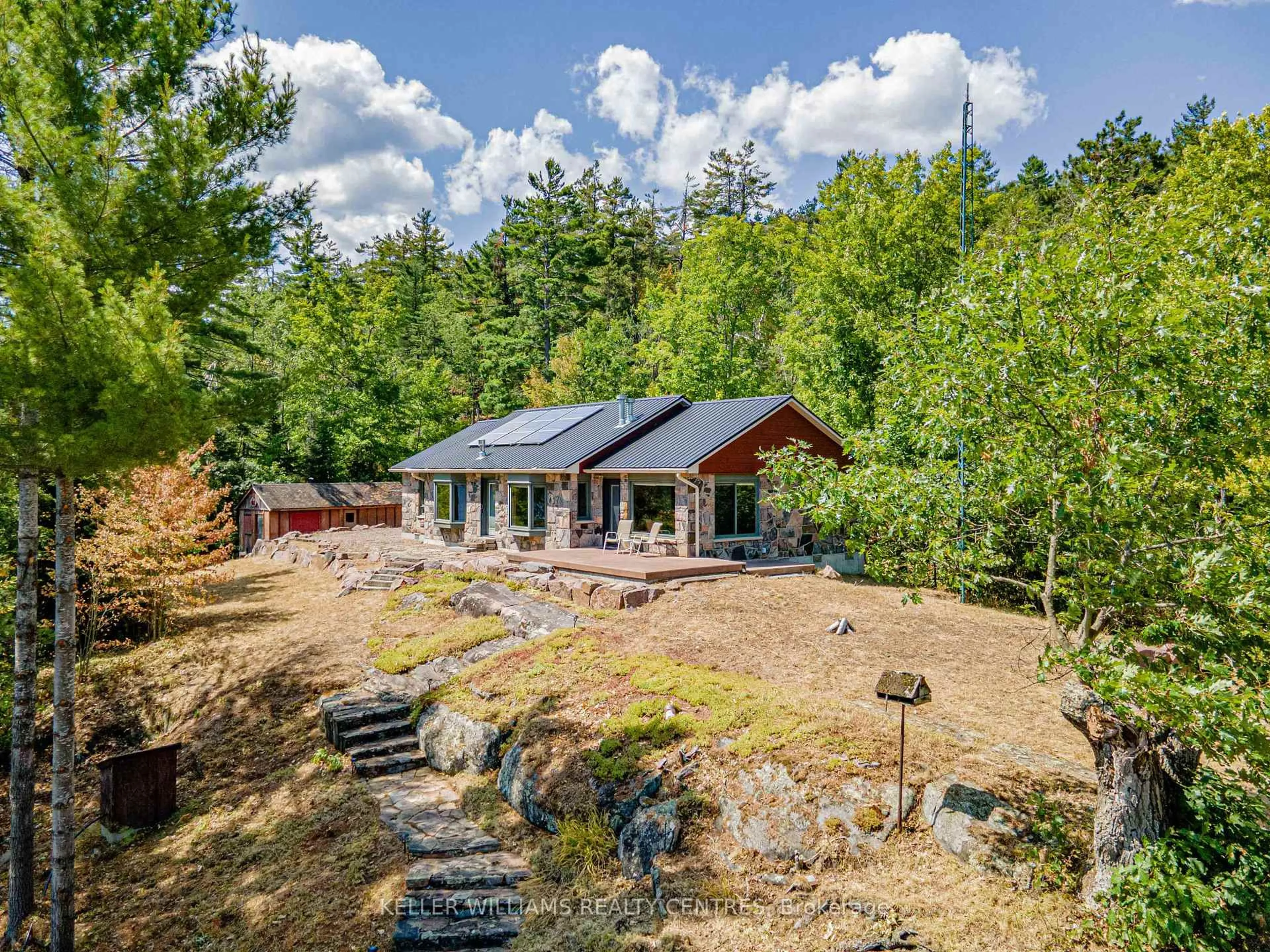 A pic from outside/outdoor area/front of a property/back of a property/a pic from drone, unknown for 98 Fire Access Rd, Trent Lakes Ontario K0L 1J0