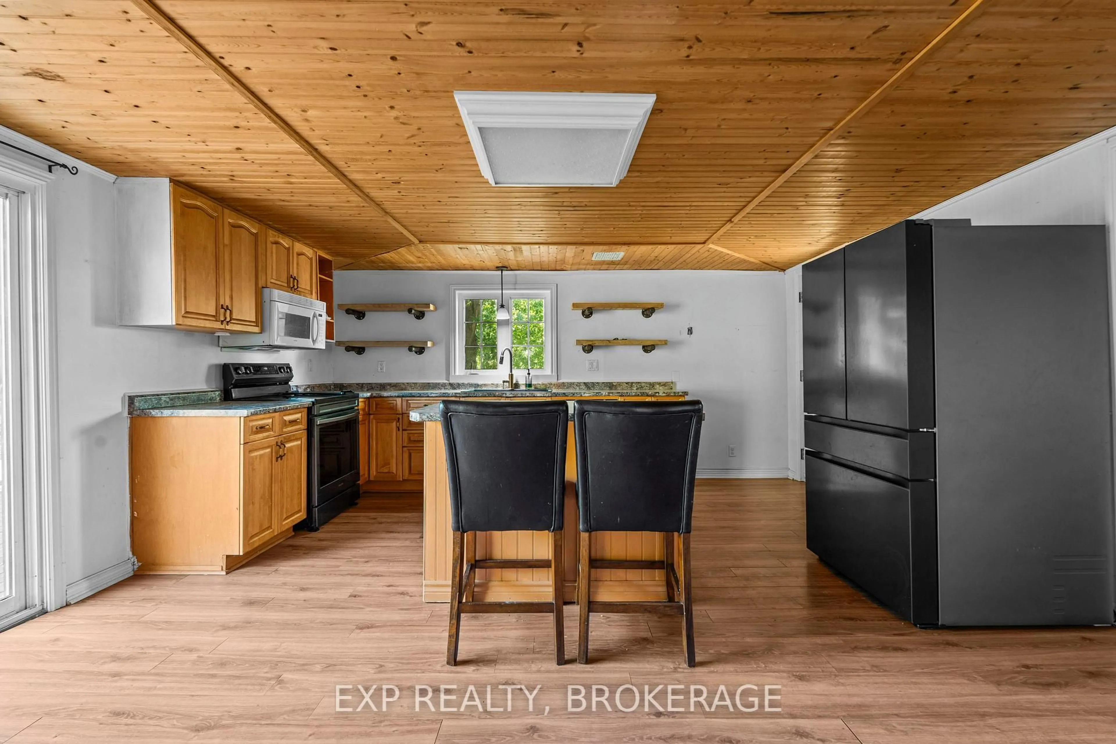 Open concept kitchen, wood/laminate floor for 129 DULCEMAINE Rd, Front of Leeds & Seeleys Bay Ontario K0E 1L0