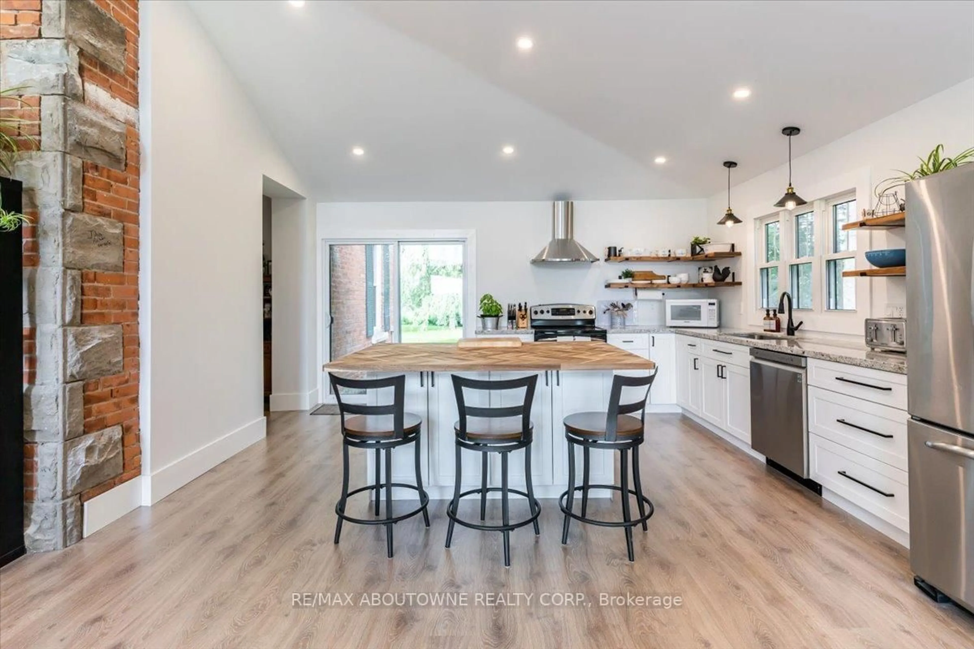 Open concept kitchen, wood/laminate floor for 674217 Hurontario St, Mono Ontario L9W 5R9