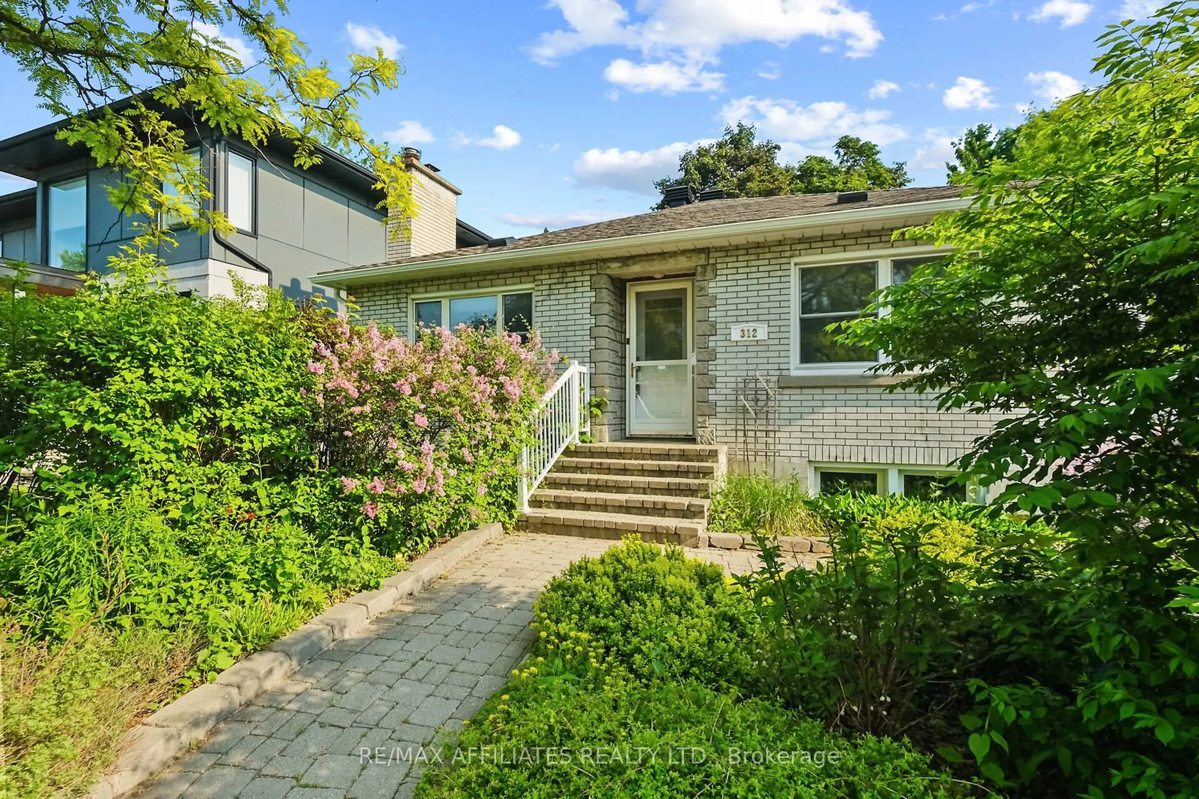 Home with brick exterior material, street for 312 Mountbatten Ave, Ottawa Ontario K1H 5W3